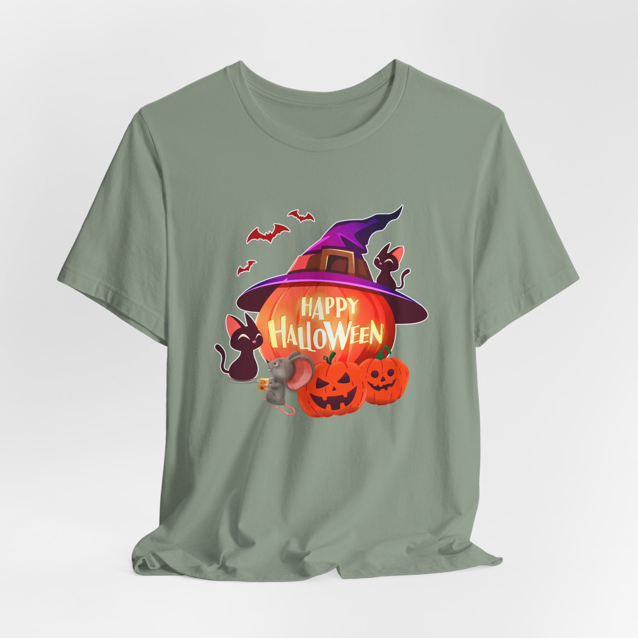 Sage green t-shirt with Halloween-themed design featuring pumpkins, bats, rodents, and a witch hat on a light gray edge background.