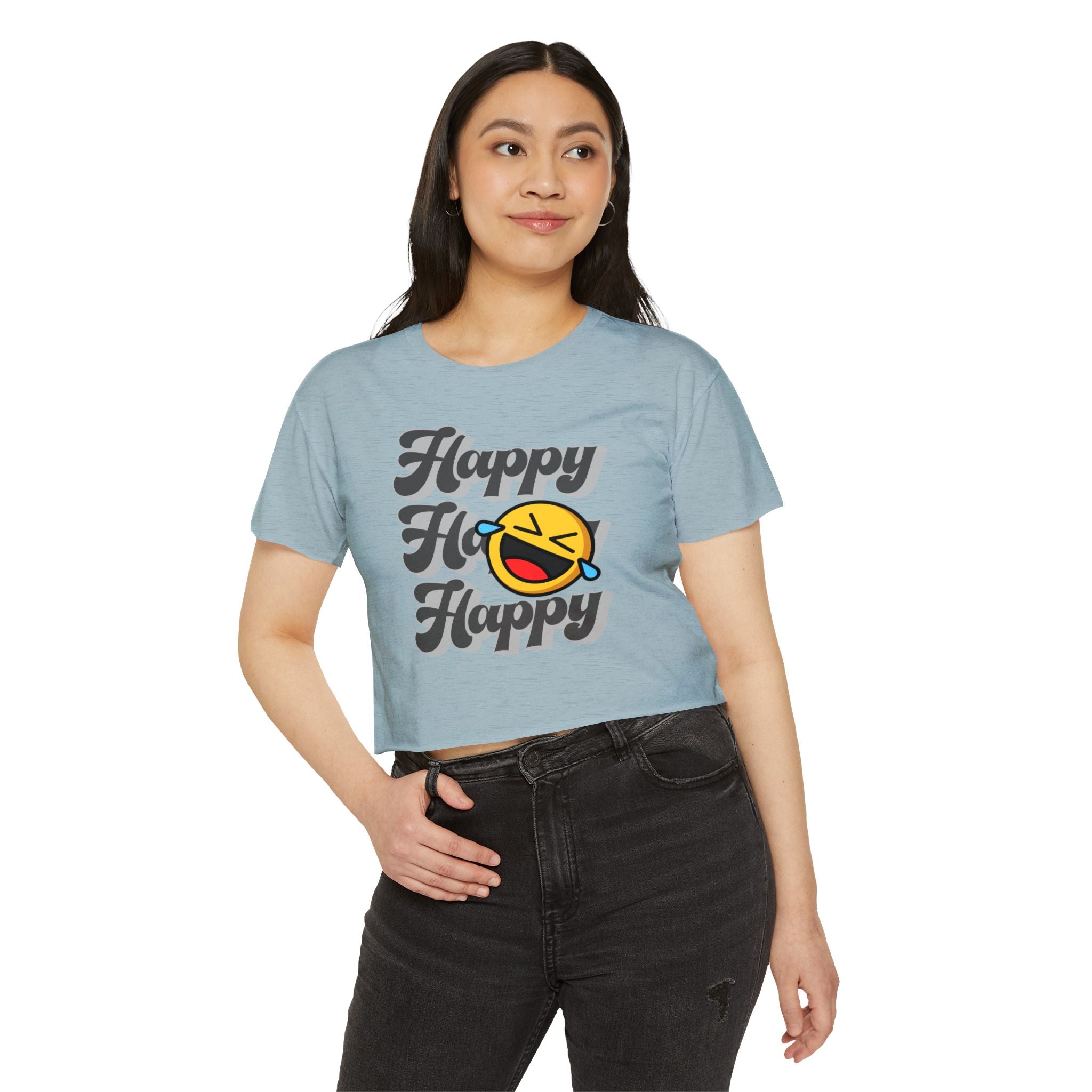 Woman wearing a light blue t-shirt with 'Happy' text and emoji design on a white background