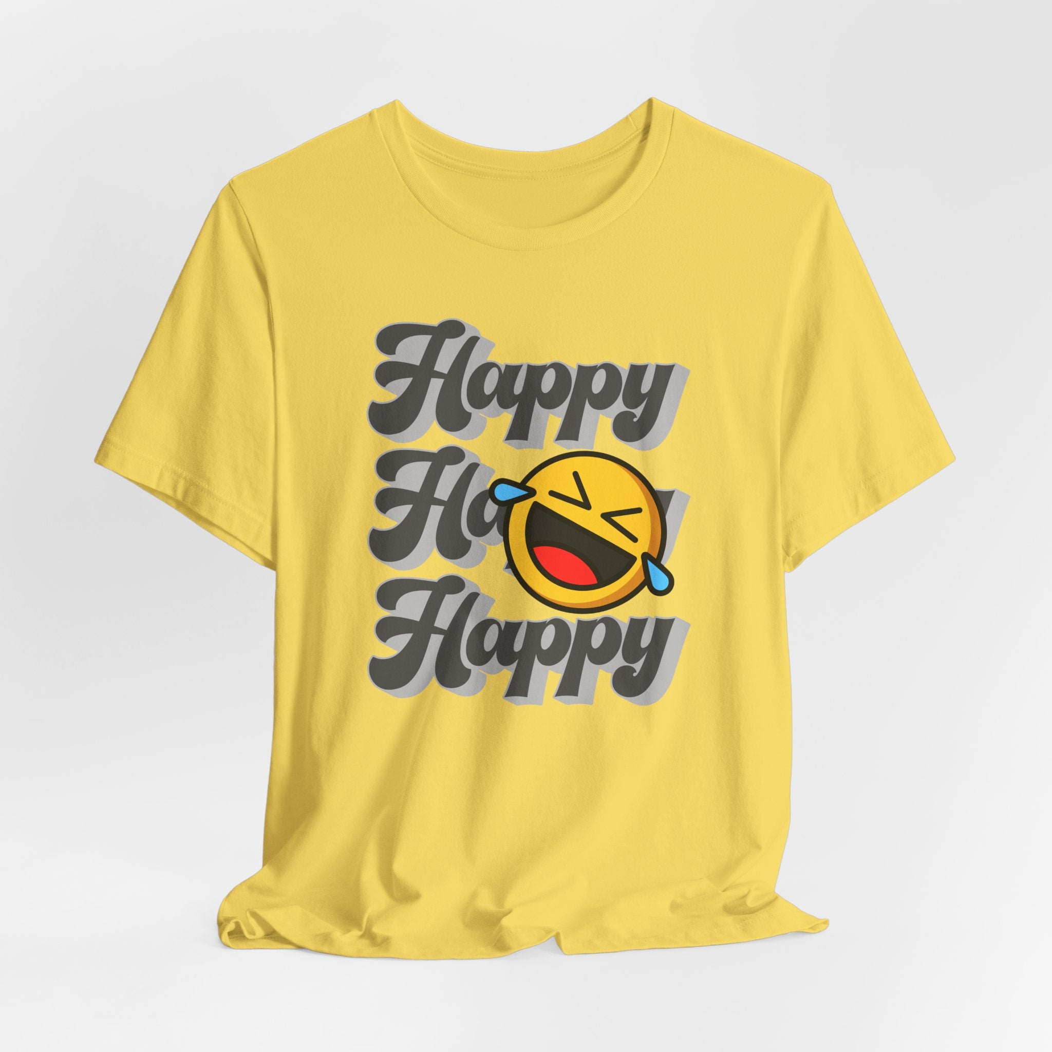 Yellow t-shirt with 'Happy Ho Happy' text and emoji on a light gray background