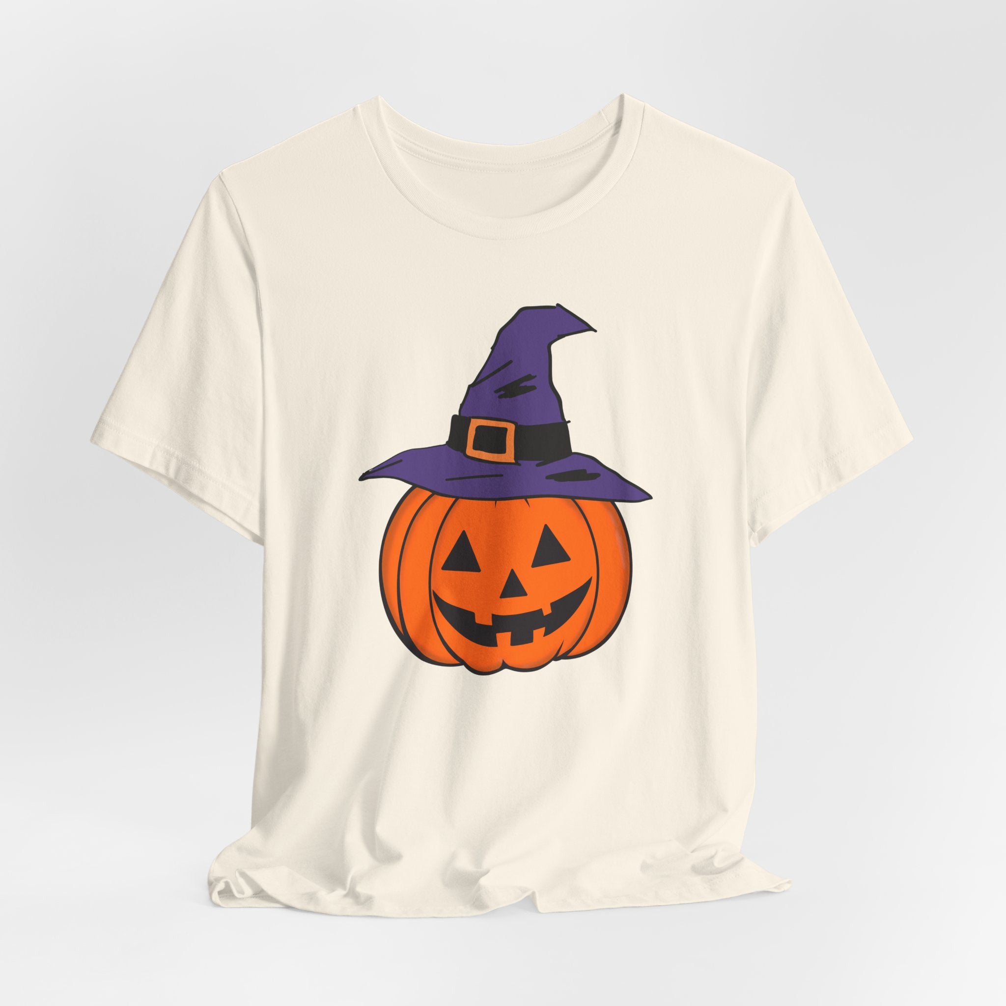Natural beige t-shirt with a Halloween pumpkin graphic on a light gray background
