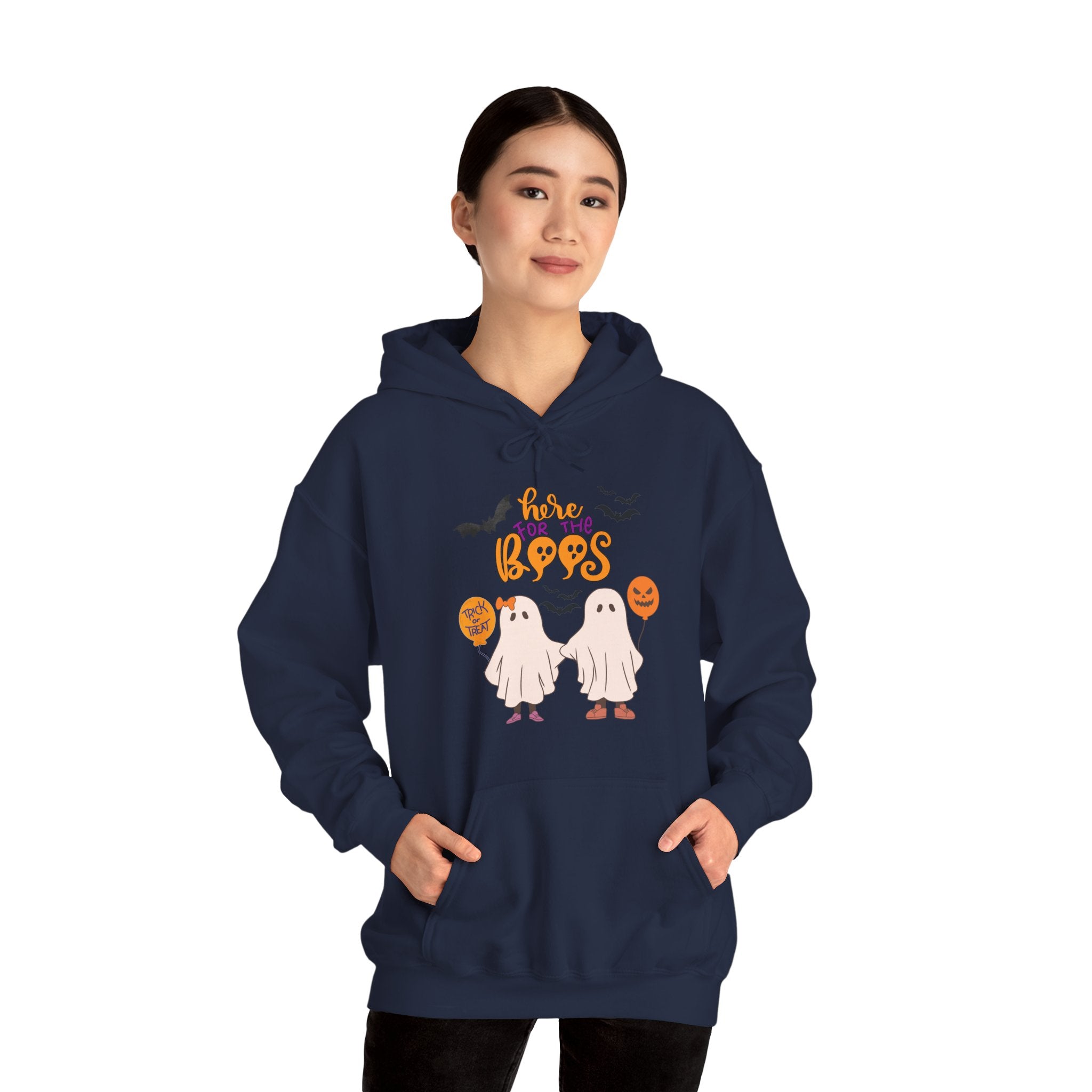 Person wearing a navy blue hoodie with Halloween-themed design on a white background