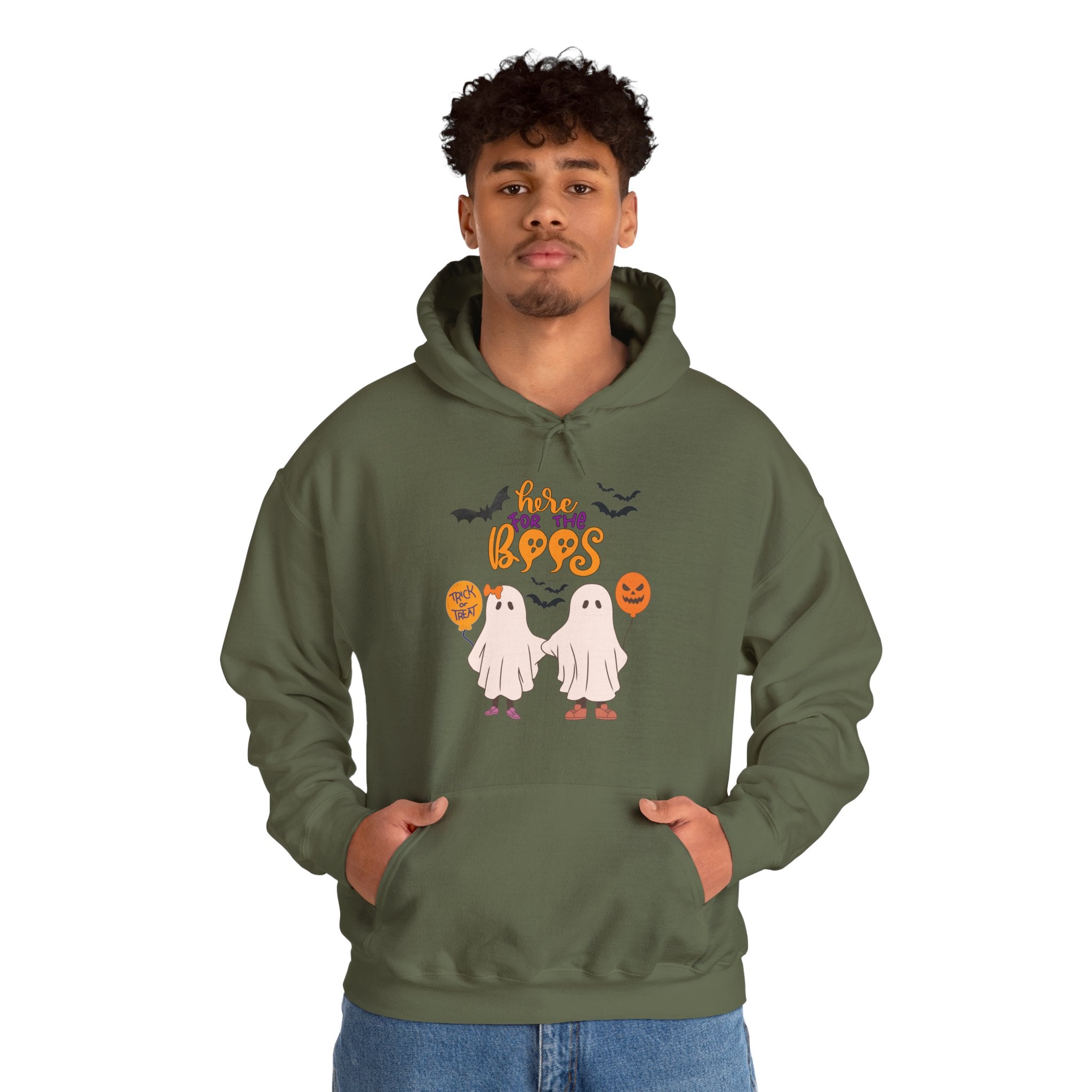 Person wearing a green hoodie with Halloween design on a white background