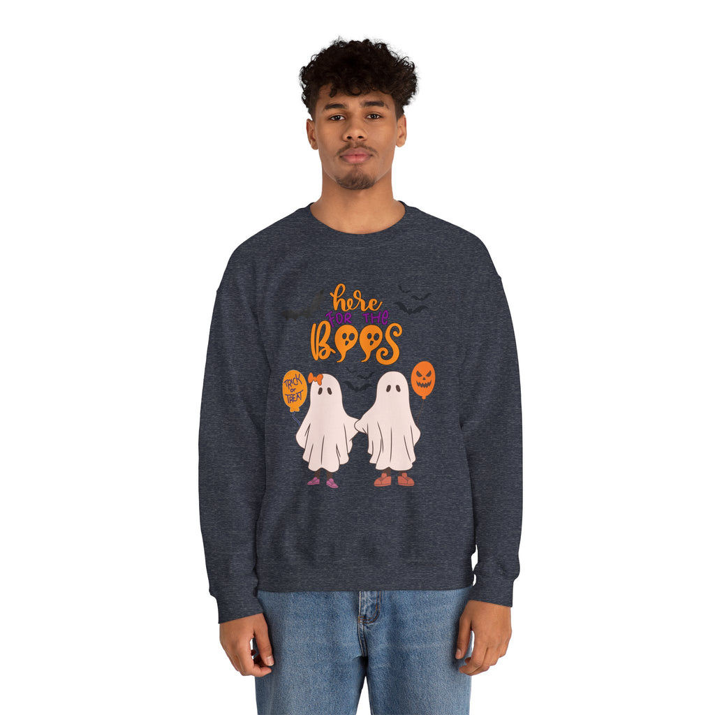 Person wearing a navy sweatshirt with Halloween-themed design on a white background