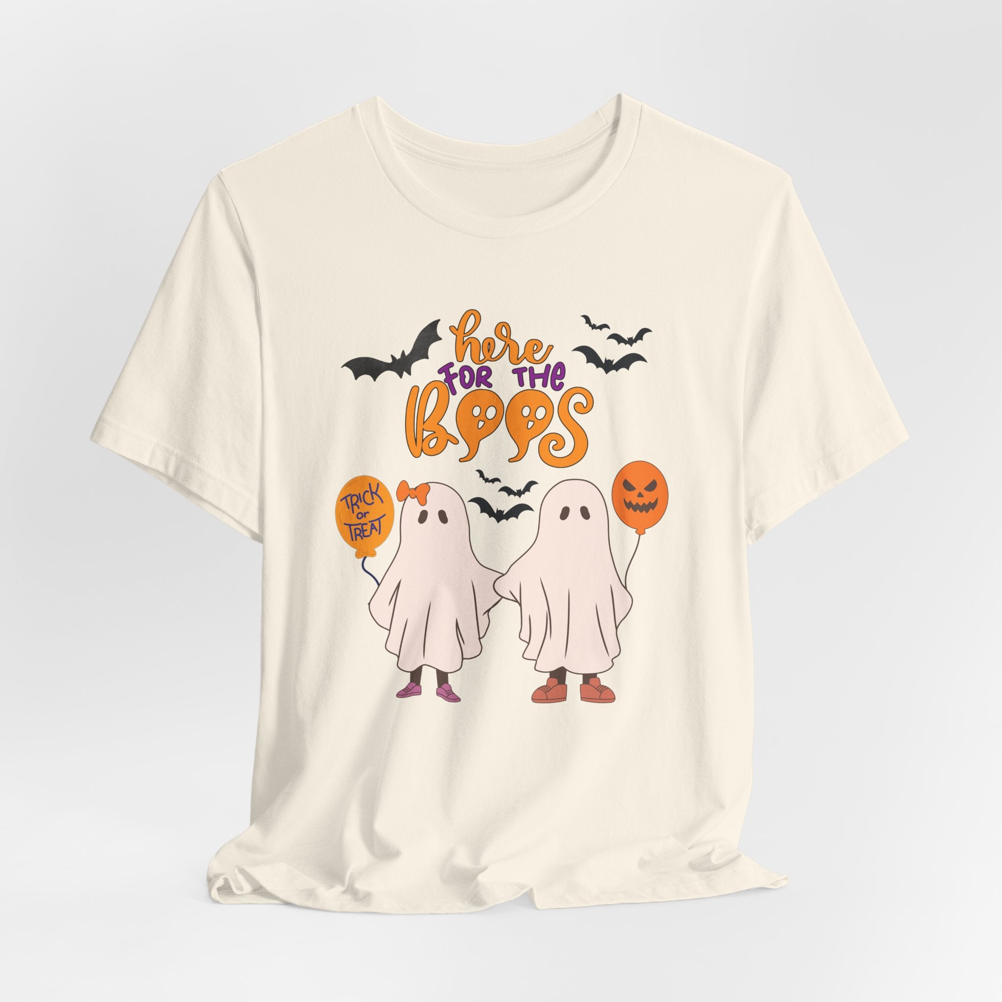 Ivory beige t-shirt with Halloween-themed graphics and text on a light gray background