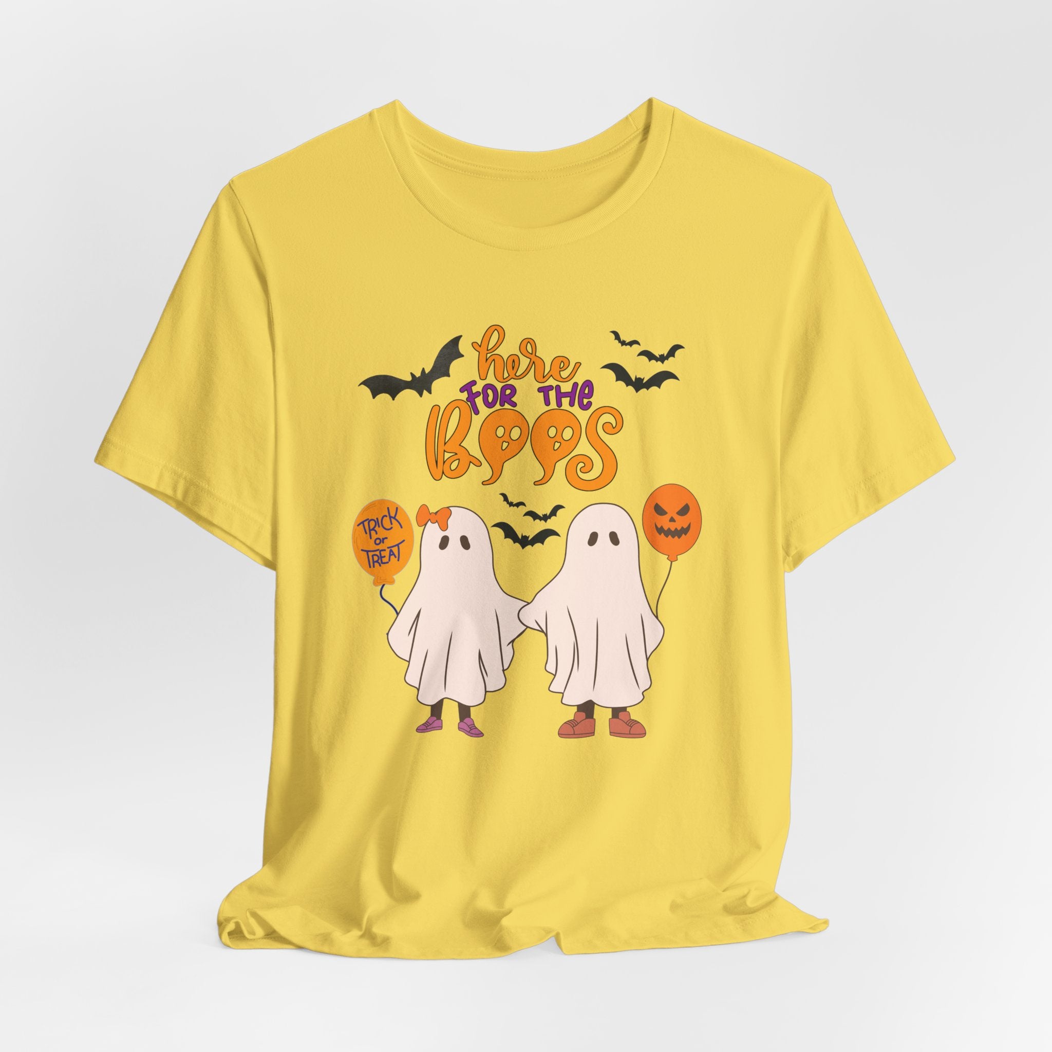 Yellow t-shirt with Halloween-themed graphics and text on a white background