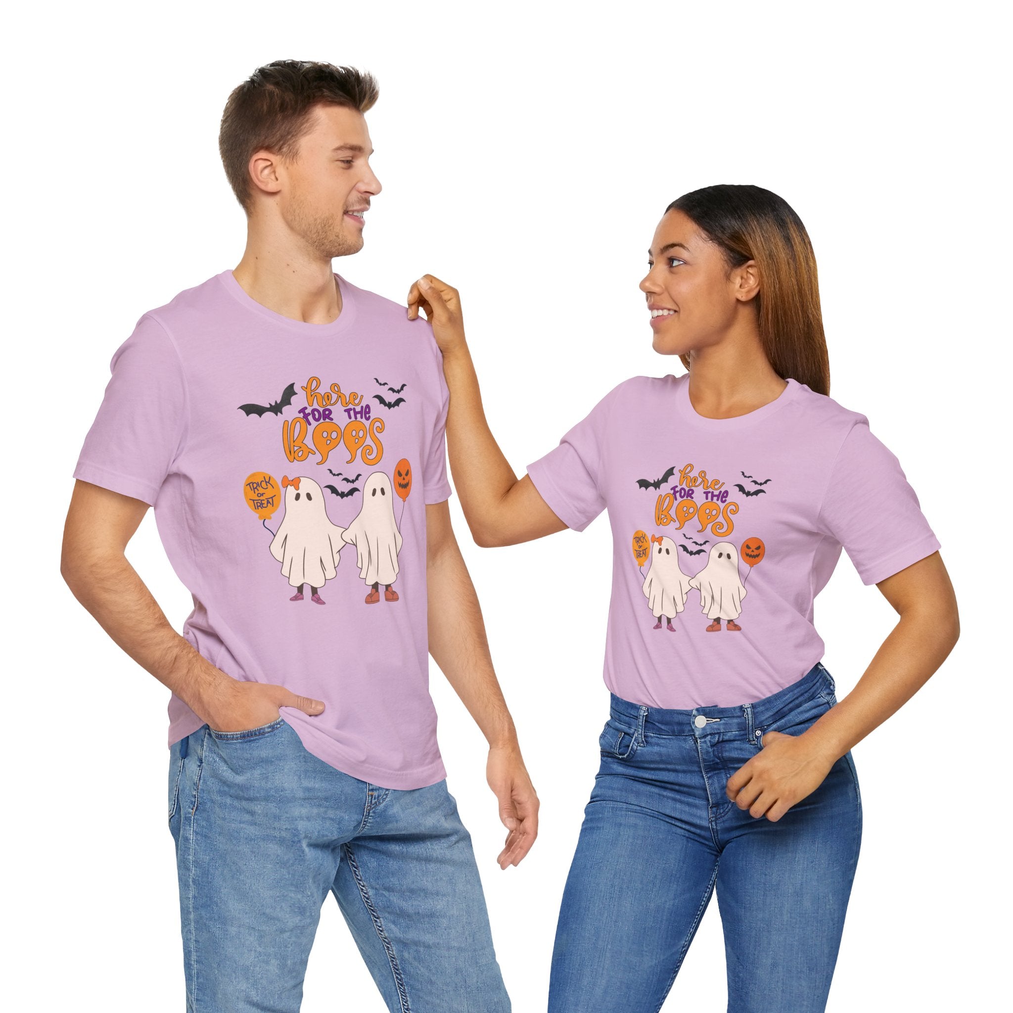 Two people wearing matching purple Halloween-themed t-shirts on a white background