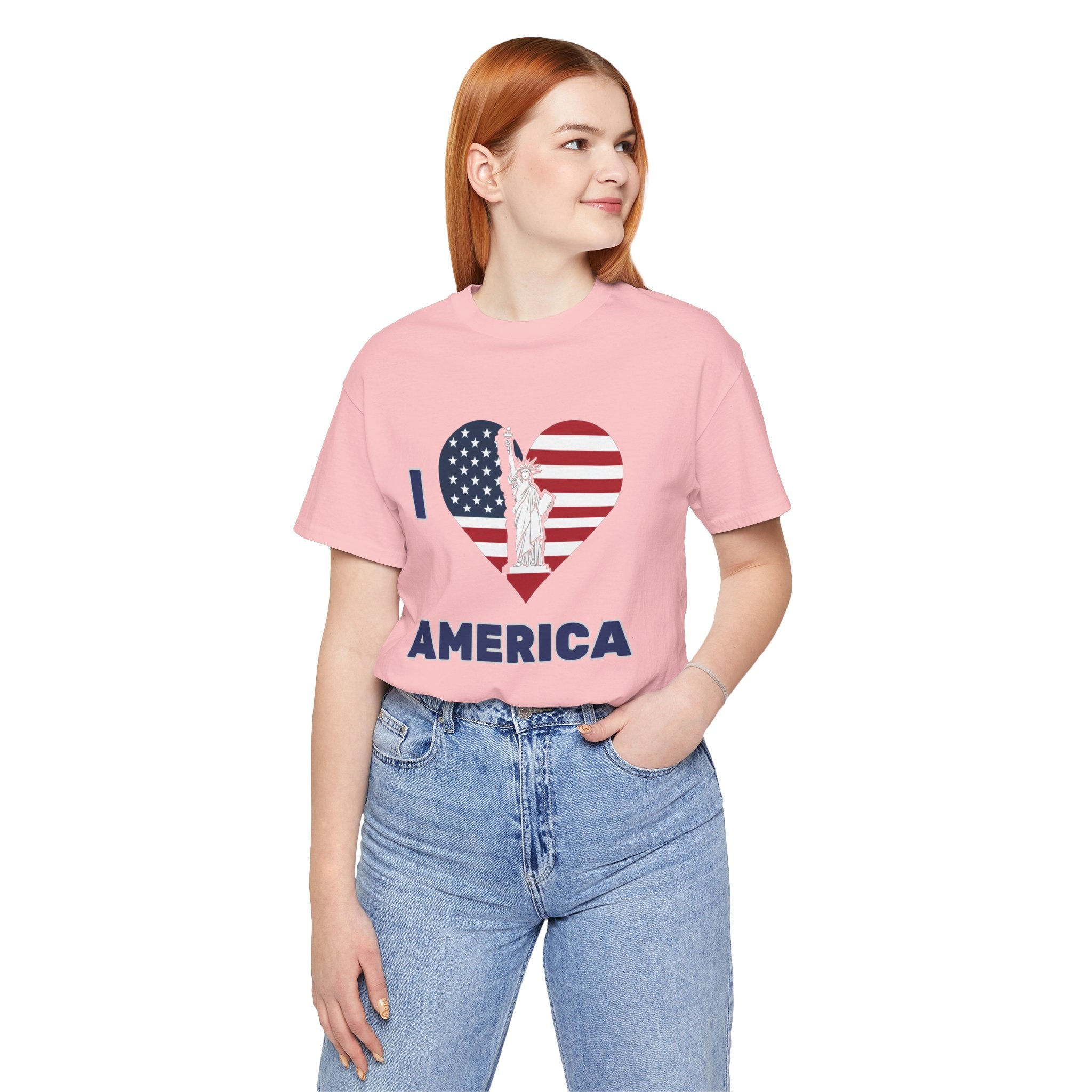 Person wearing a pink t-shirt with 'I ❤️ AMERICA' design on a white background