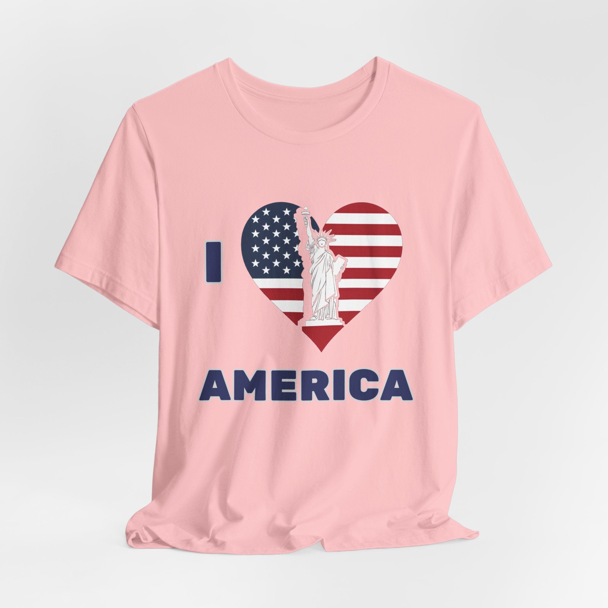 Pink t-shirt with 'I love America' design featuring the Statue of Liberty on a gray background