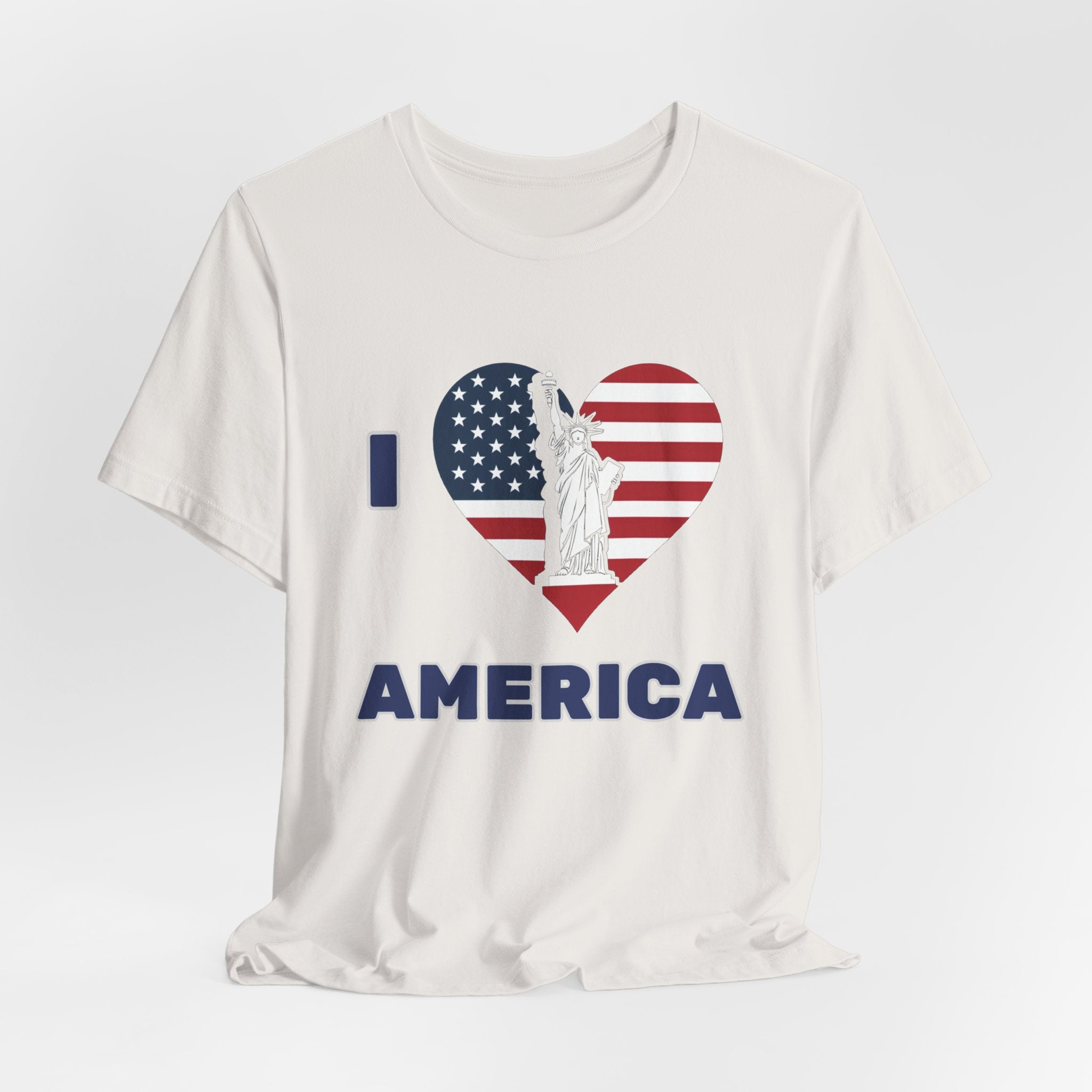Vintage white t-shirt with 'I ❤️ AMERICA' design featuring an American flag heart and Statue of Liberty on a white background.