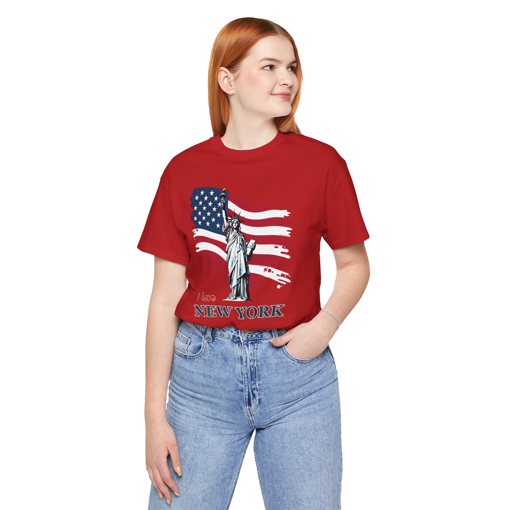 Person wearing a red t-shirt with a graphic design and text, standing against a white background