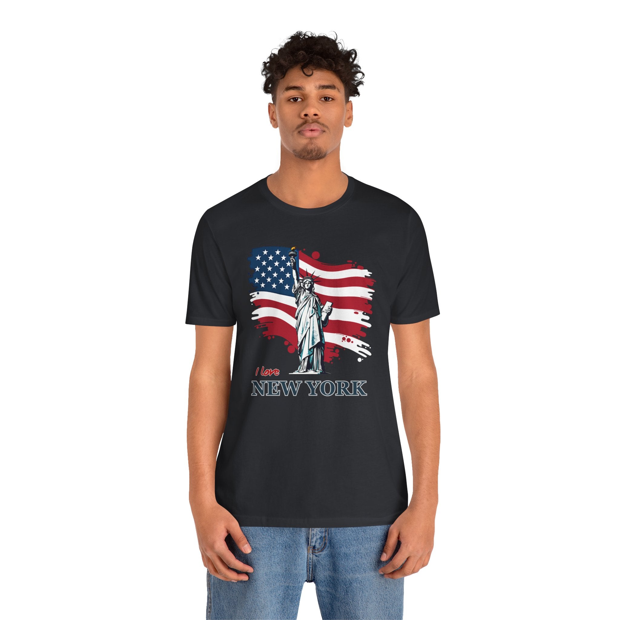 Person wearing a black t-shirt with an American flag and Statue of Liberty graphic, text 'I love New York' on a white background.