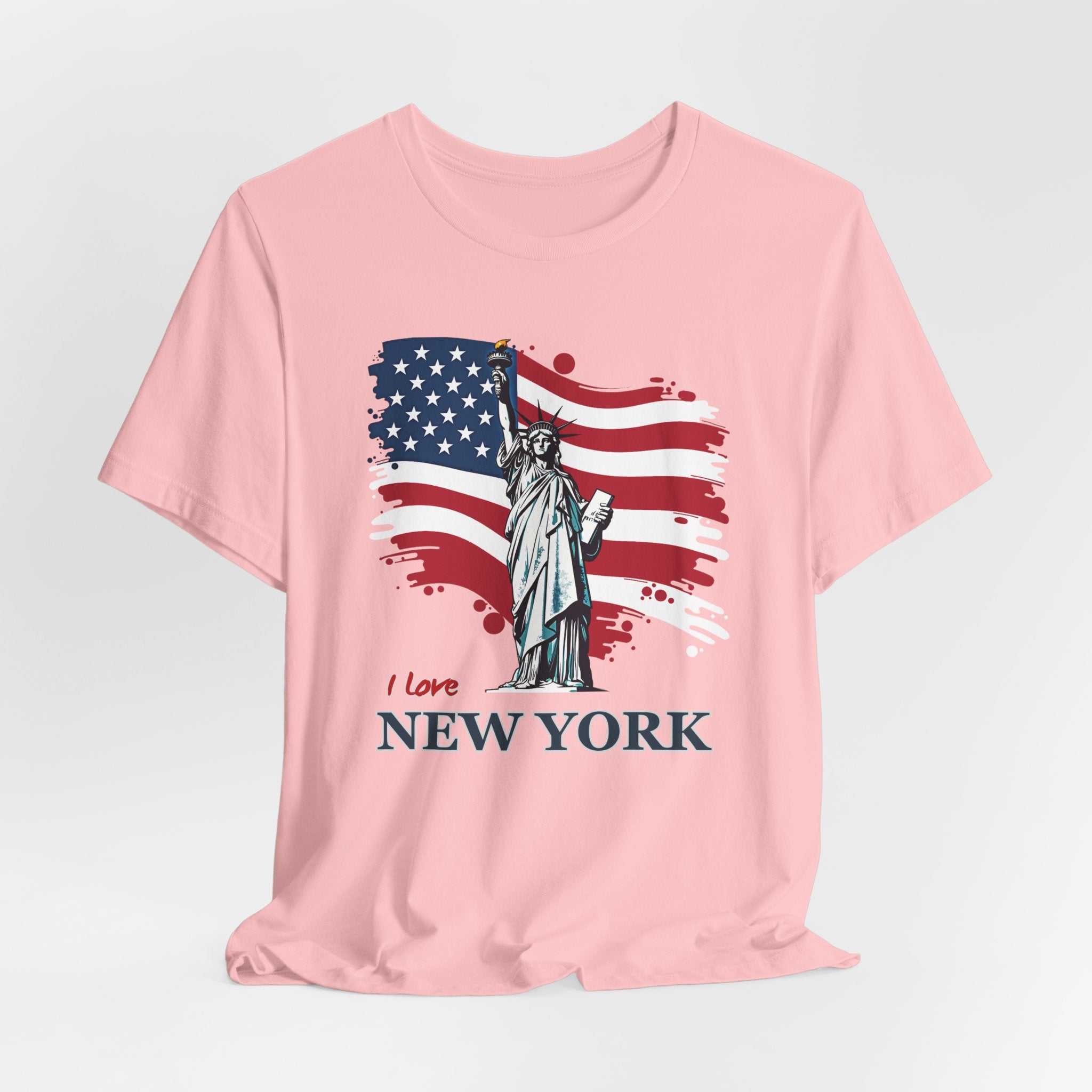 Pink t-shirt with Statue of Liberty and American flag design with I love New York text on a white background