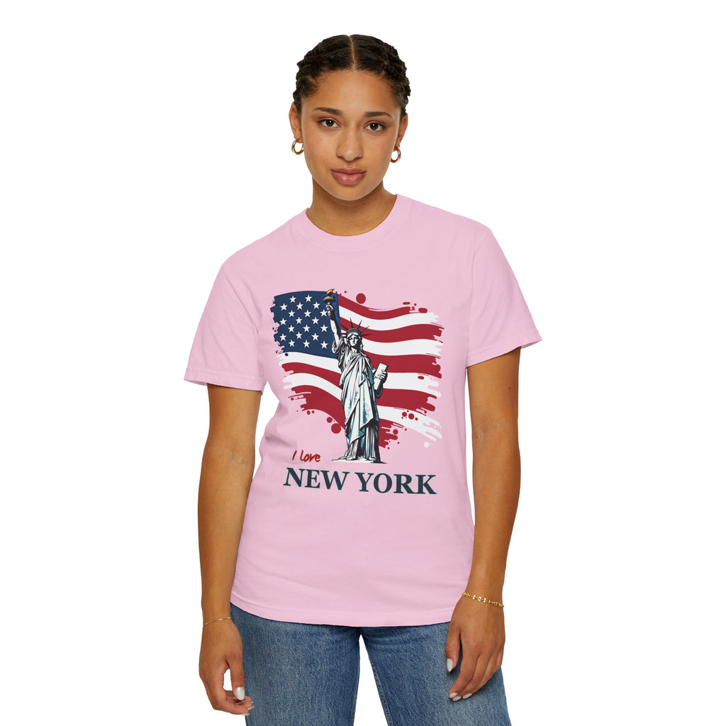 Person wearing a pink t-shirt with an American flag and Statue of Liberty design, text 'I love New York'.