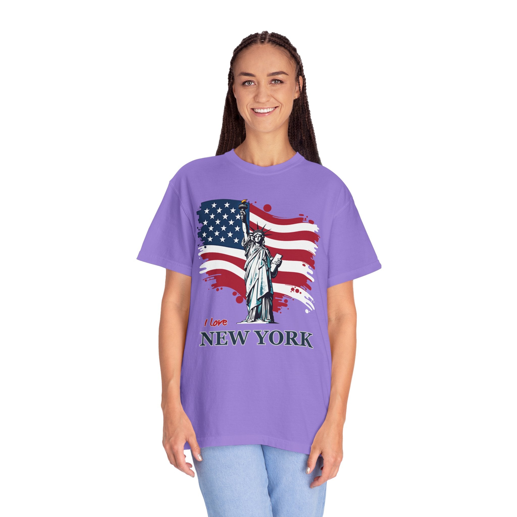 Person wearing a purple t-shirt with an American flag and Statue of Liberty design, text 'I love New York'.