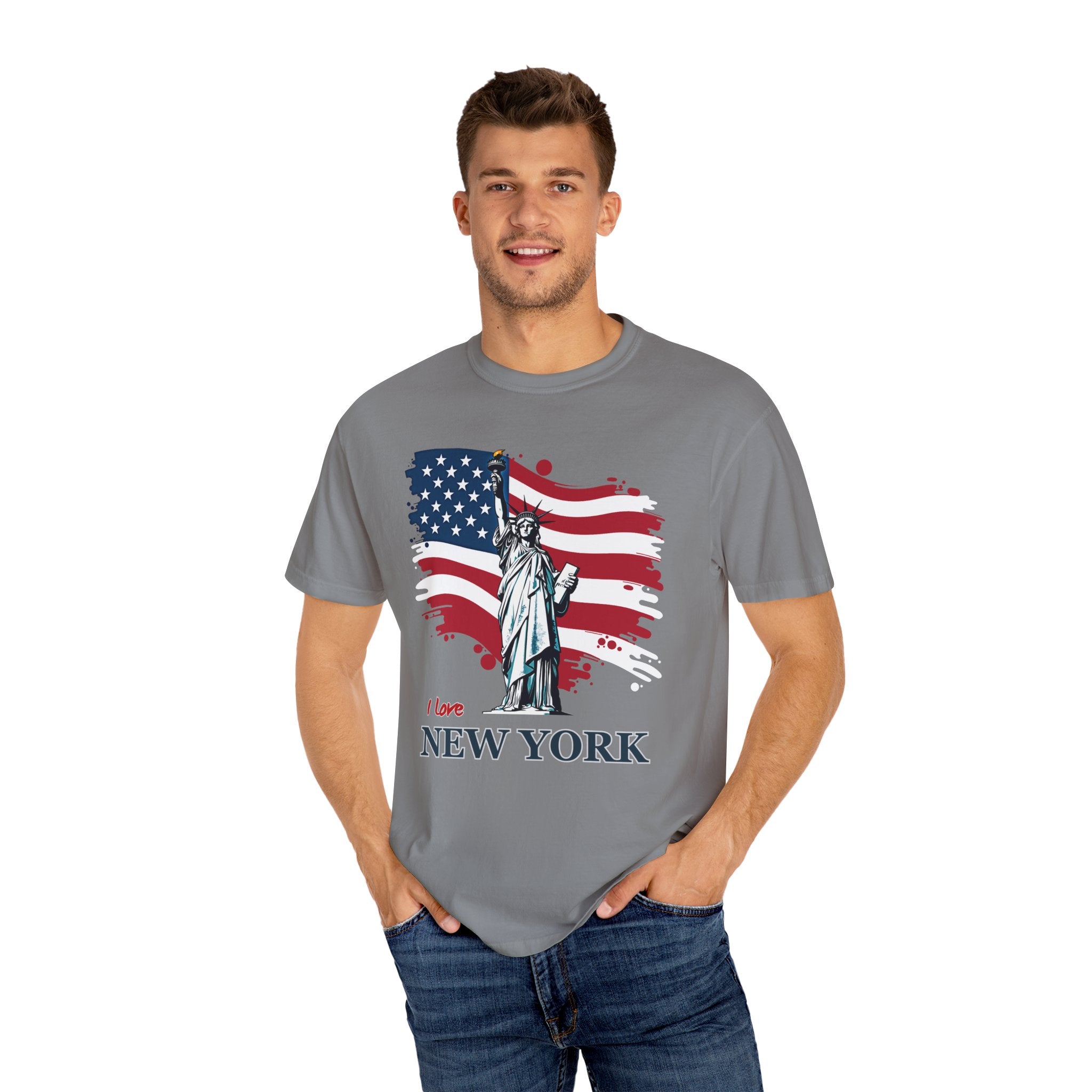 Man wearing a gray t-shirt with an American flag and Statue of Liberty design on a white background