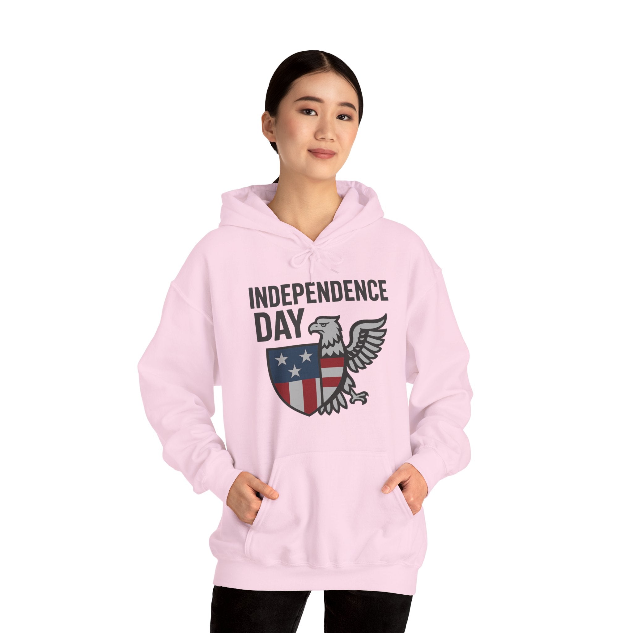 Person wearing a pink hoodie with 'Independence Day' and an eagle graphic on a white background