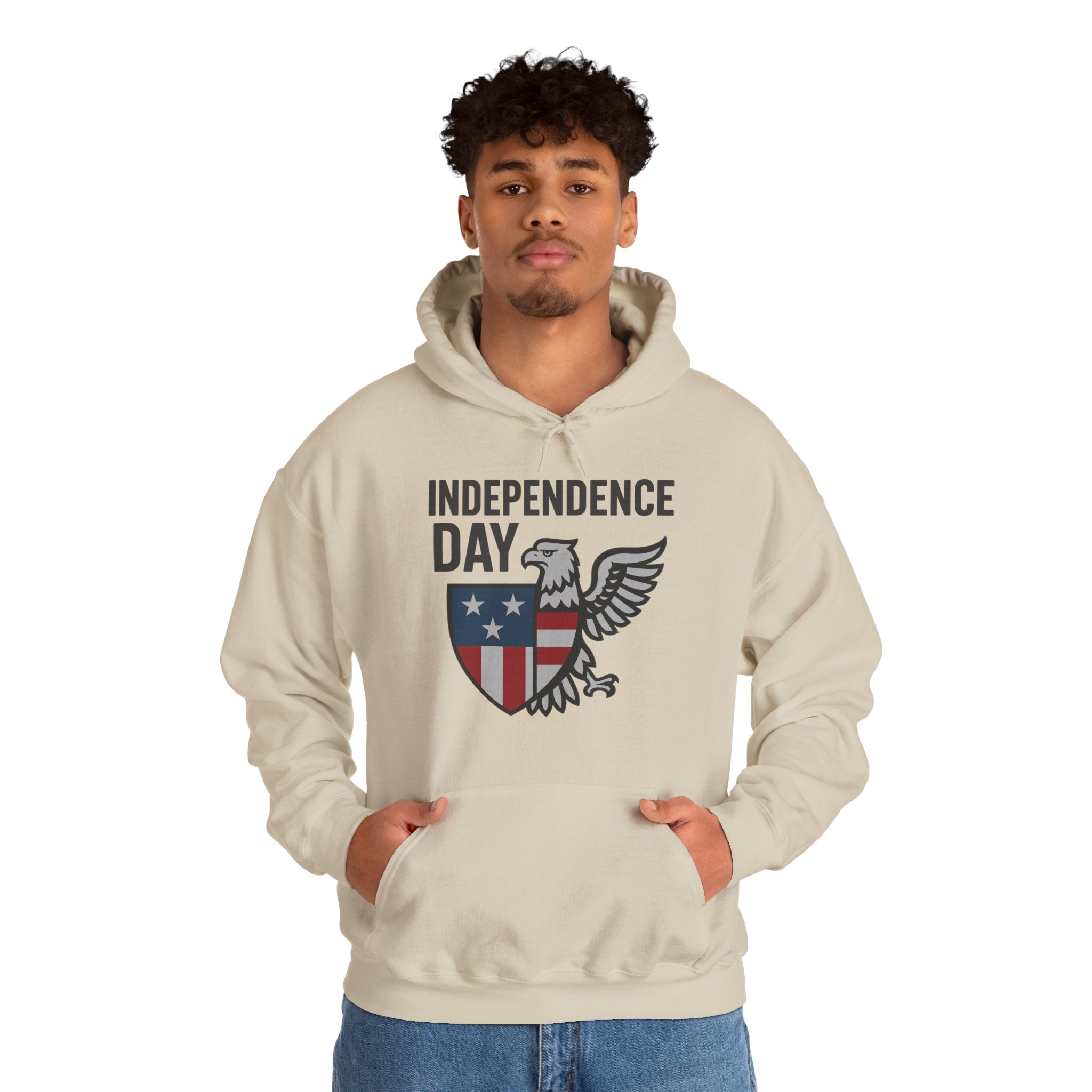 Person wearing a beige hoodie with 'Independence Day' and eagle design on a white background