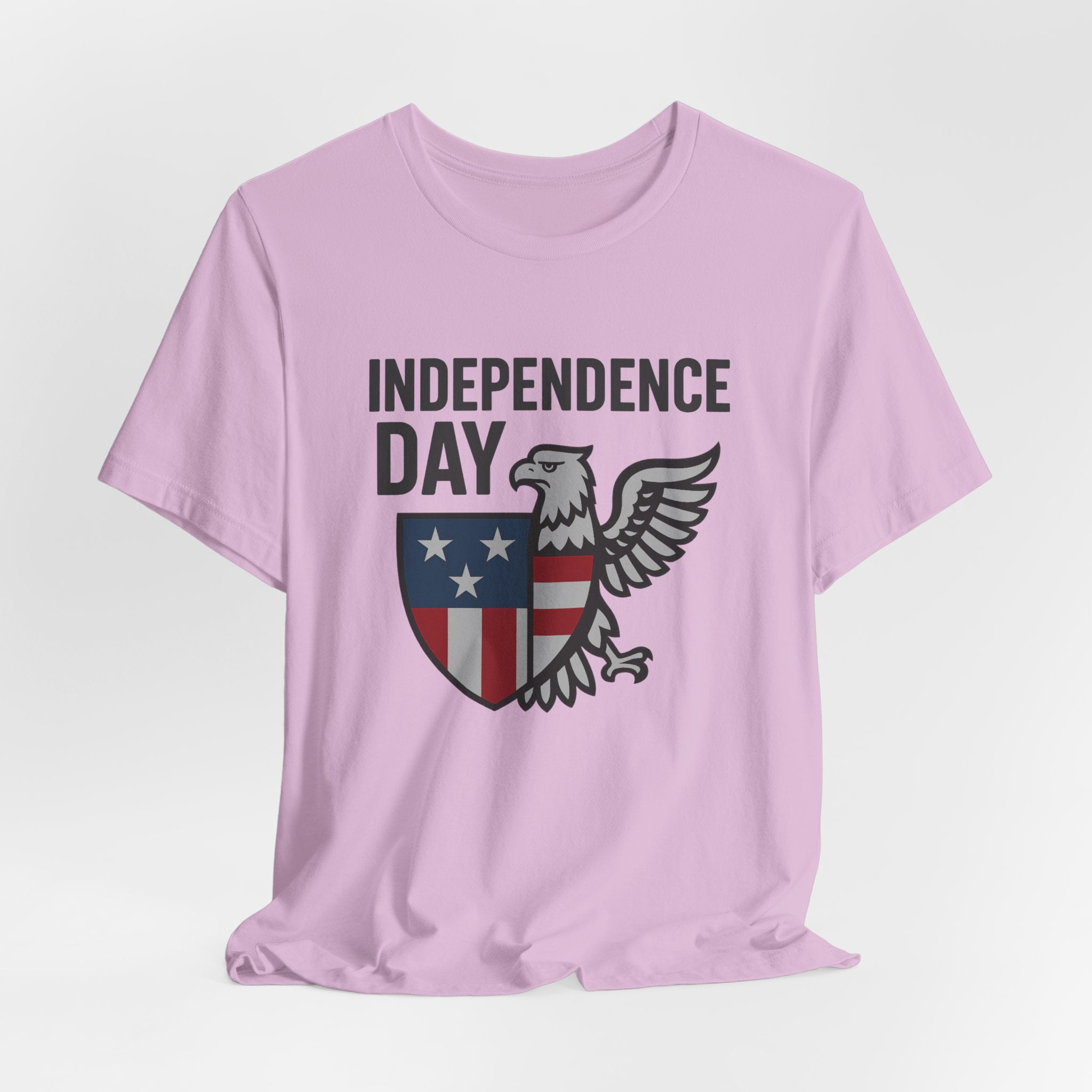 Lilac pink t-shirt with 'Independence Day' graphic on a light gray background