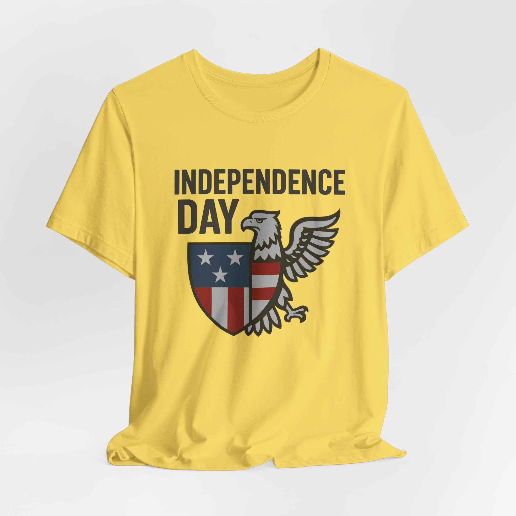 Maze yellow t-shirt with 'Independence Day' design featuring an eagle and shield on a white background