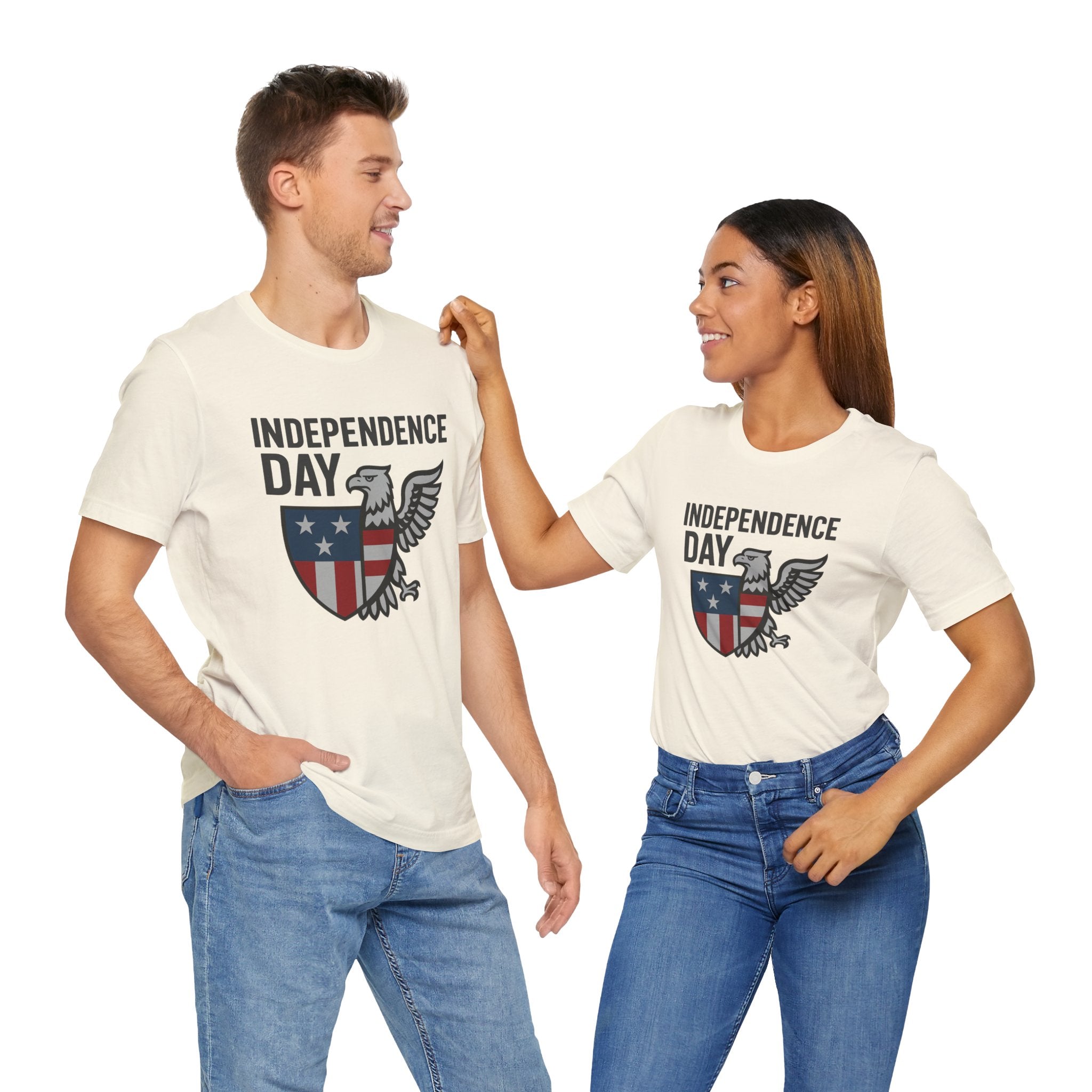 Two people wearing 'Independence Day' t-shirts with an eagle design on a white background