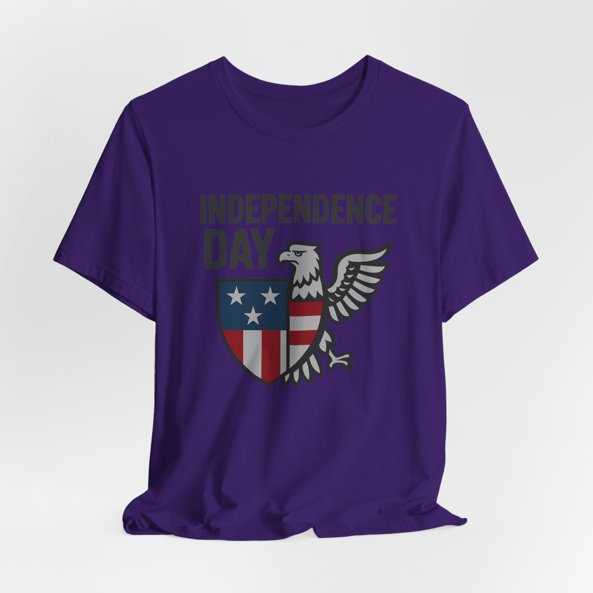 Purple t-shirt with 'Independence Day' design featuring an eagle and shield on a white background