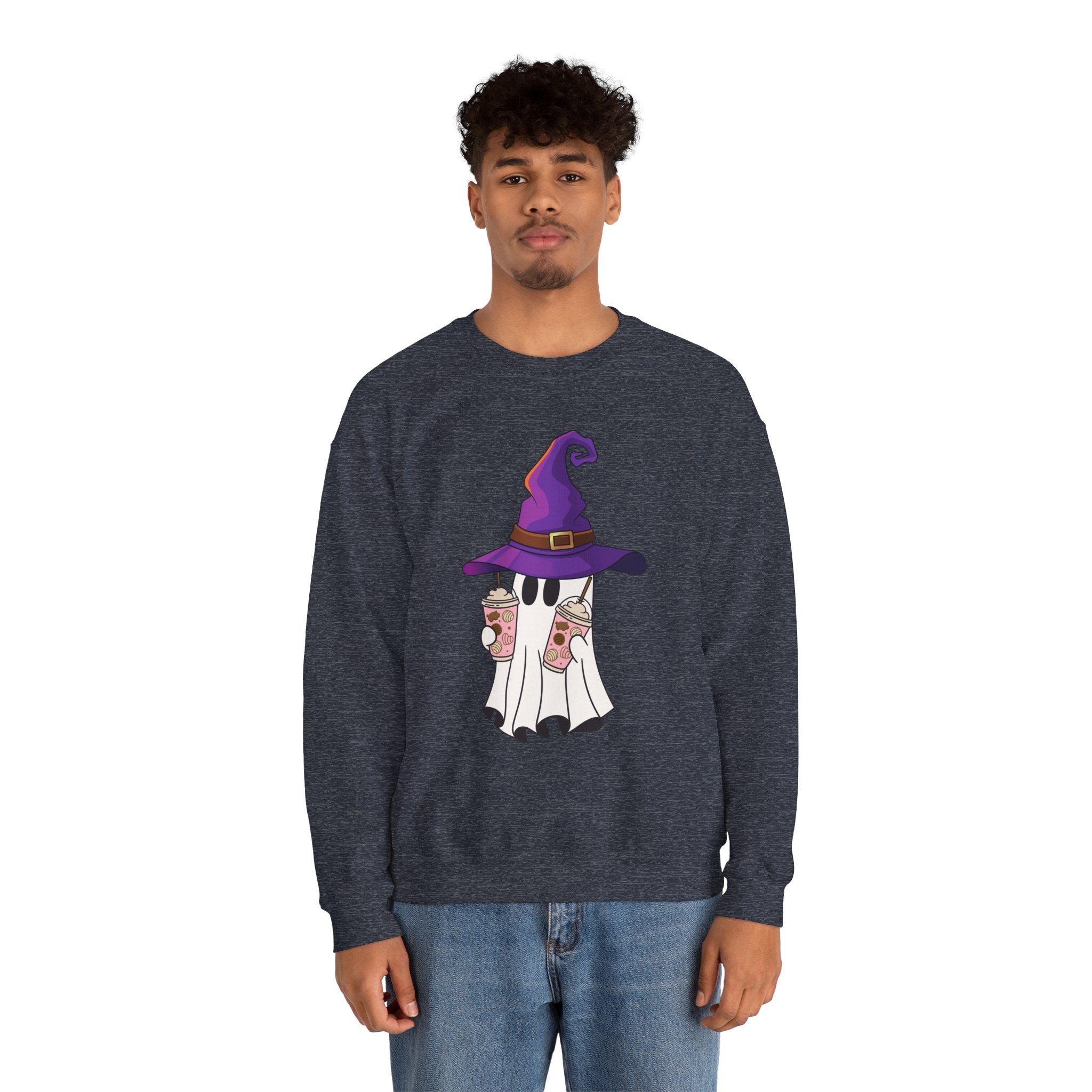 Person wearing a dark blue sweatshirt with a ghost wearing a purple witch hat design on a white background