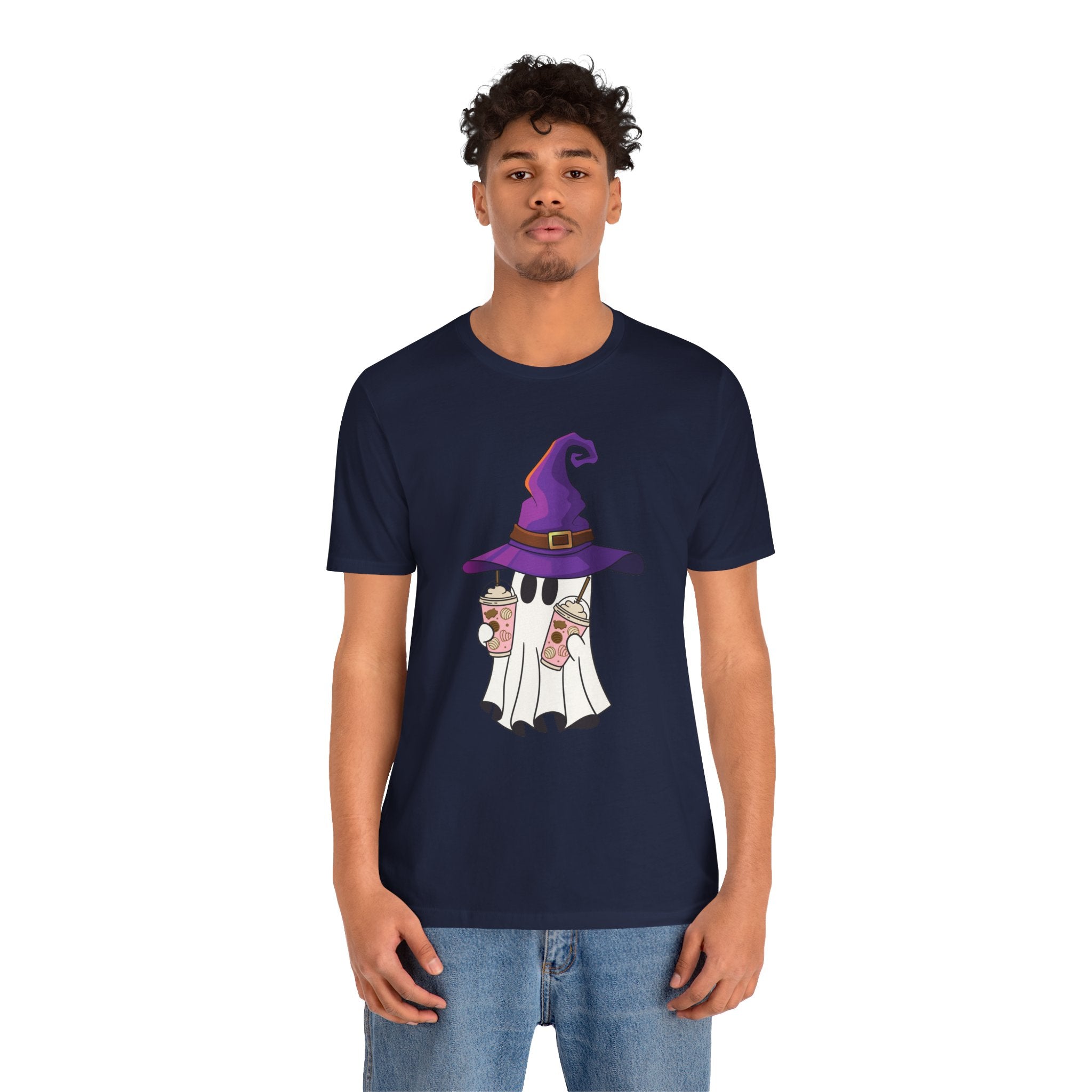 Person wearing a navy blue t-shirt with a graphic design on a white background