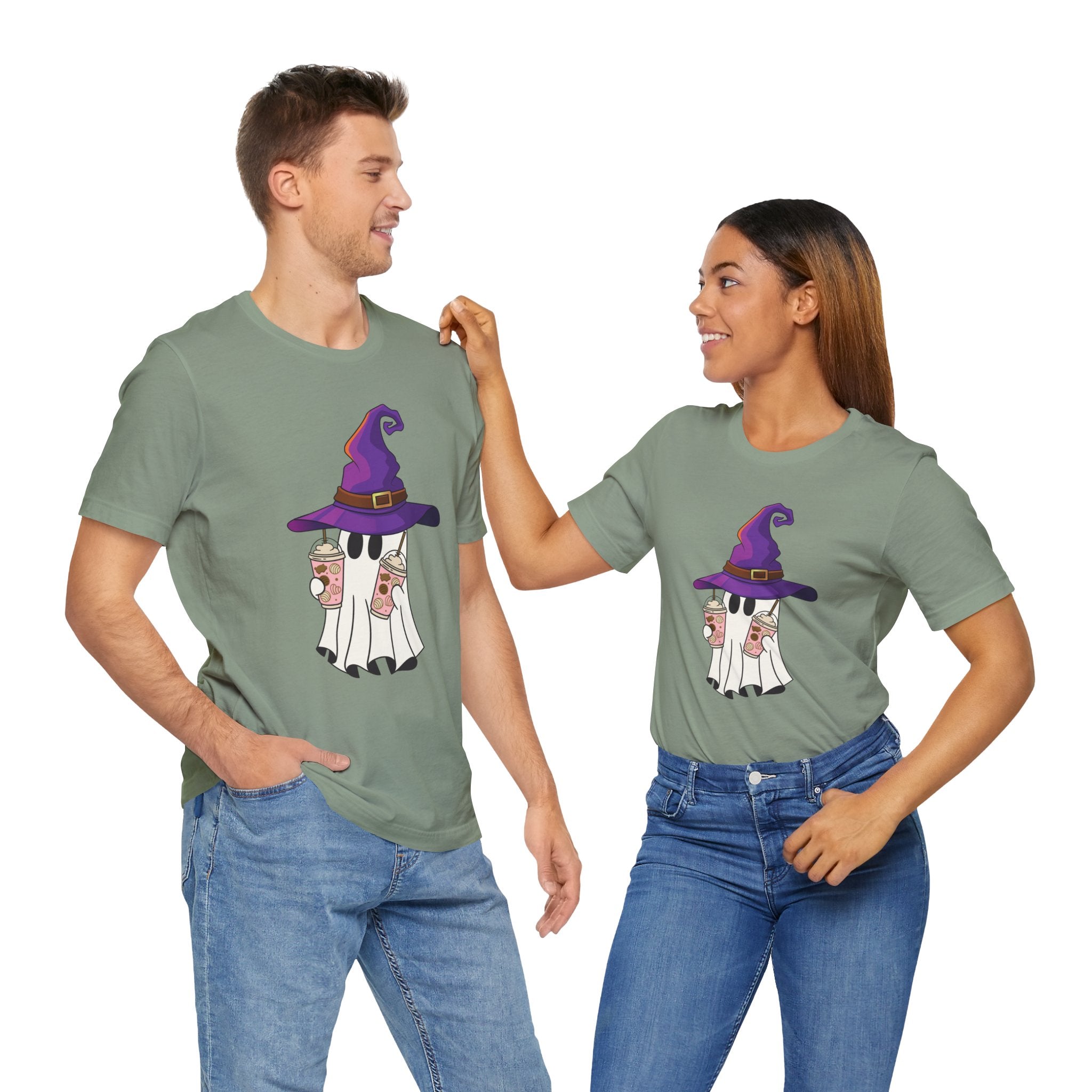 Two people wearing matching green t-shirts with a graphic design on a white background