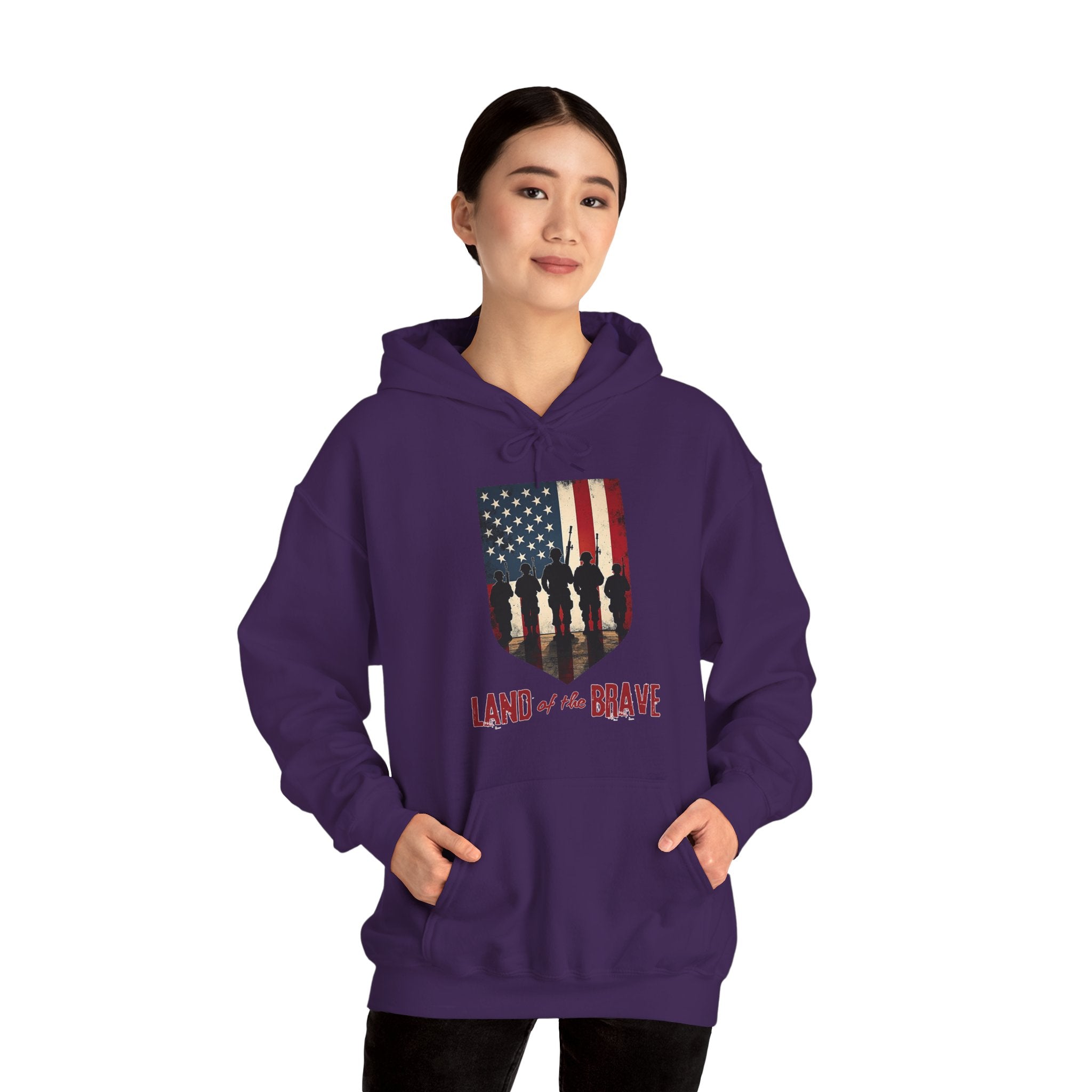 Person wearing a purple hoodie with an American flag design and 'Land of the Brave' text on a white background