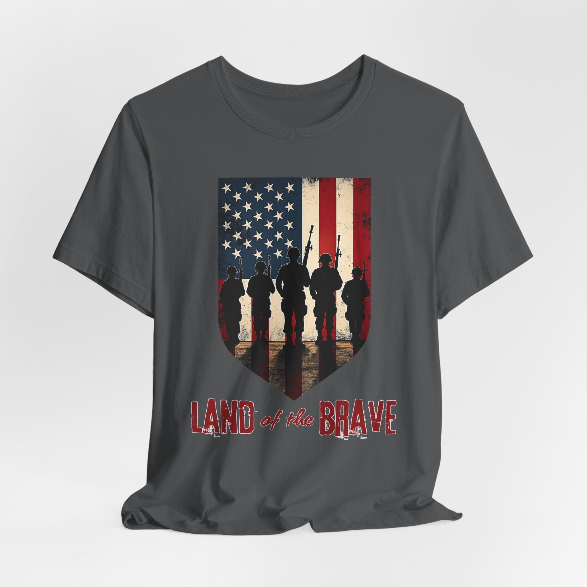 Asphalt gray t-shirt with vintage American flag, soldiers, and silhouette design with land of the brave text on a white background