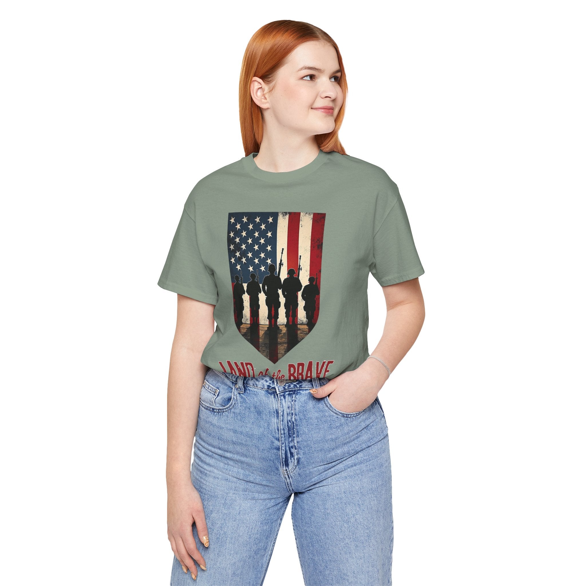 Person wearing a green t-shirt with an American flag design and text.
