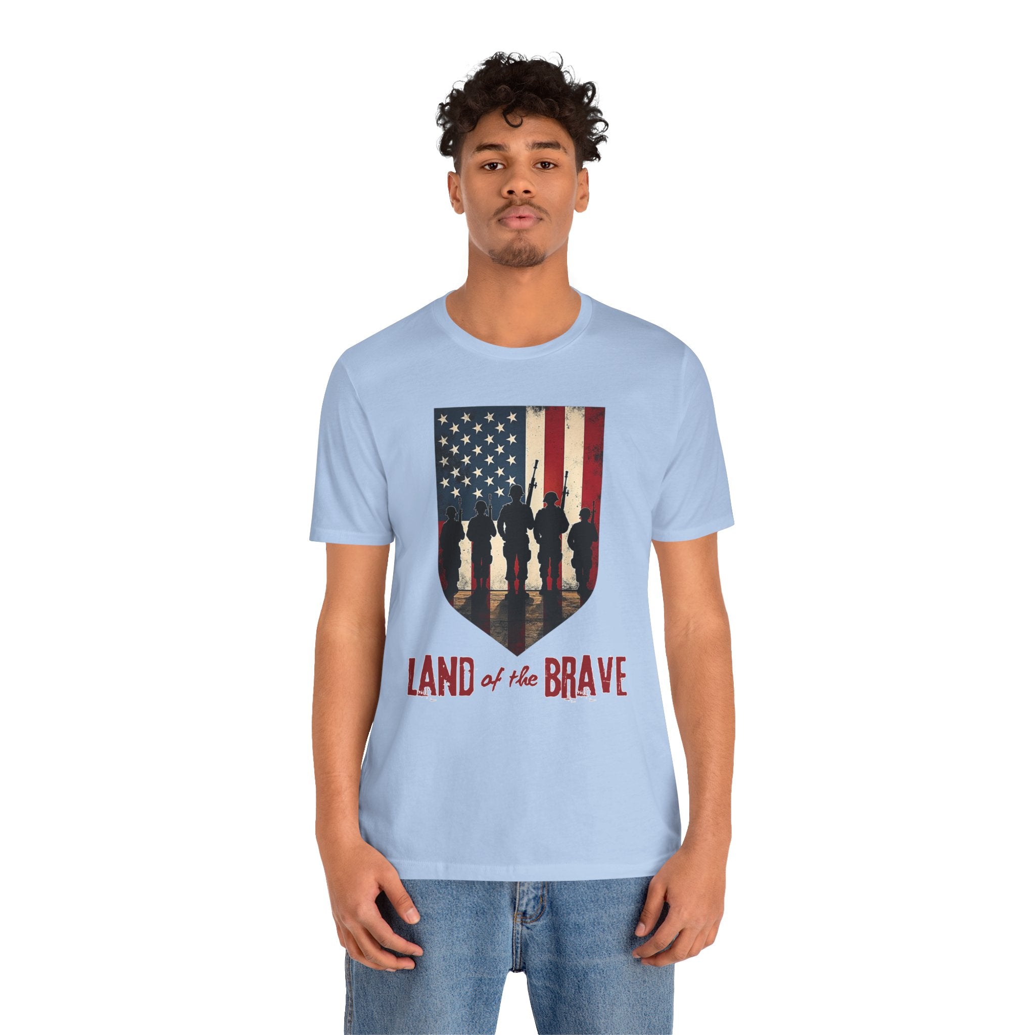 Person wearing a light blue t-shirt with an American flag design and text on a white background