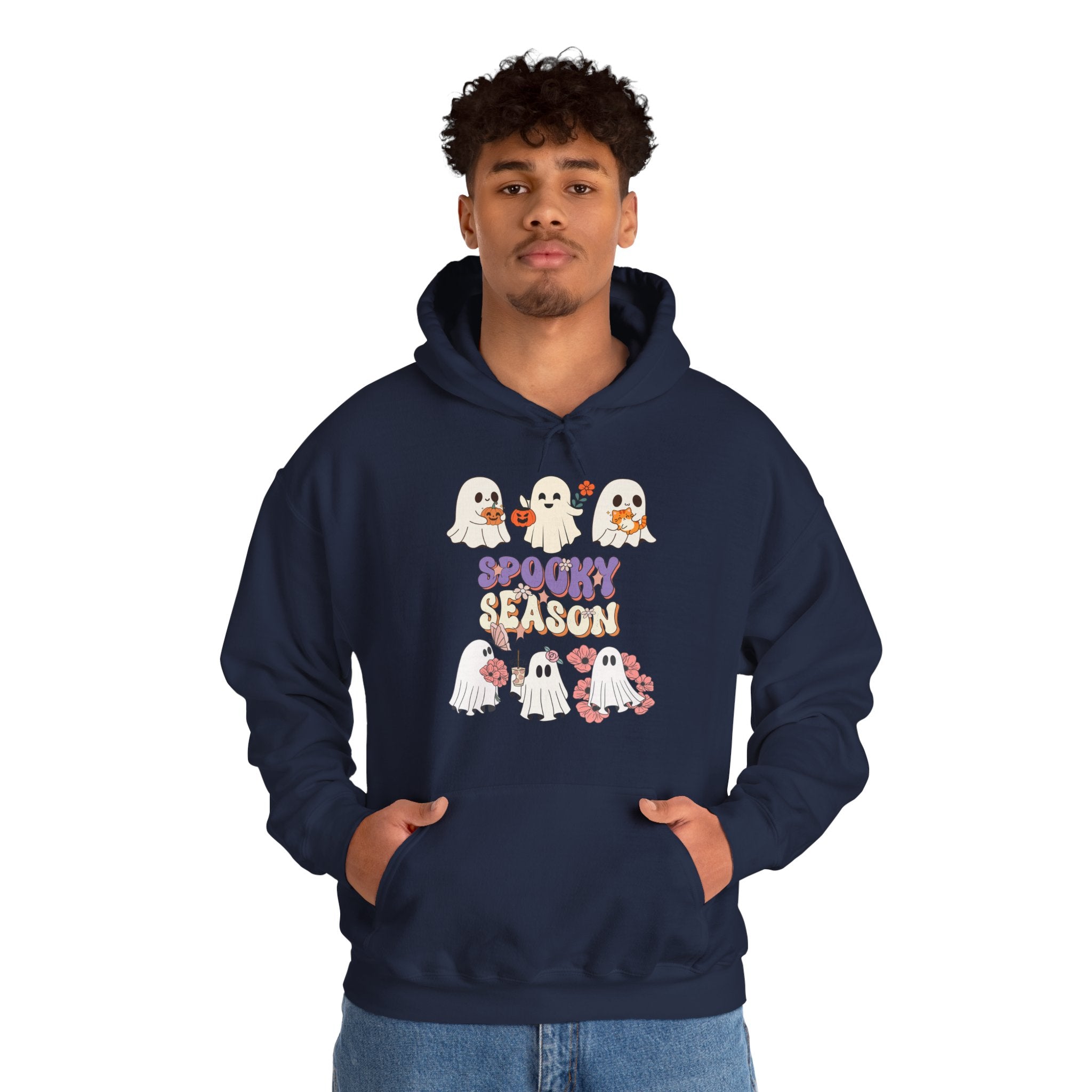 Person wearing a navy hoodie with Halloween-themed design on a white background