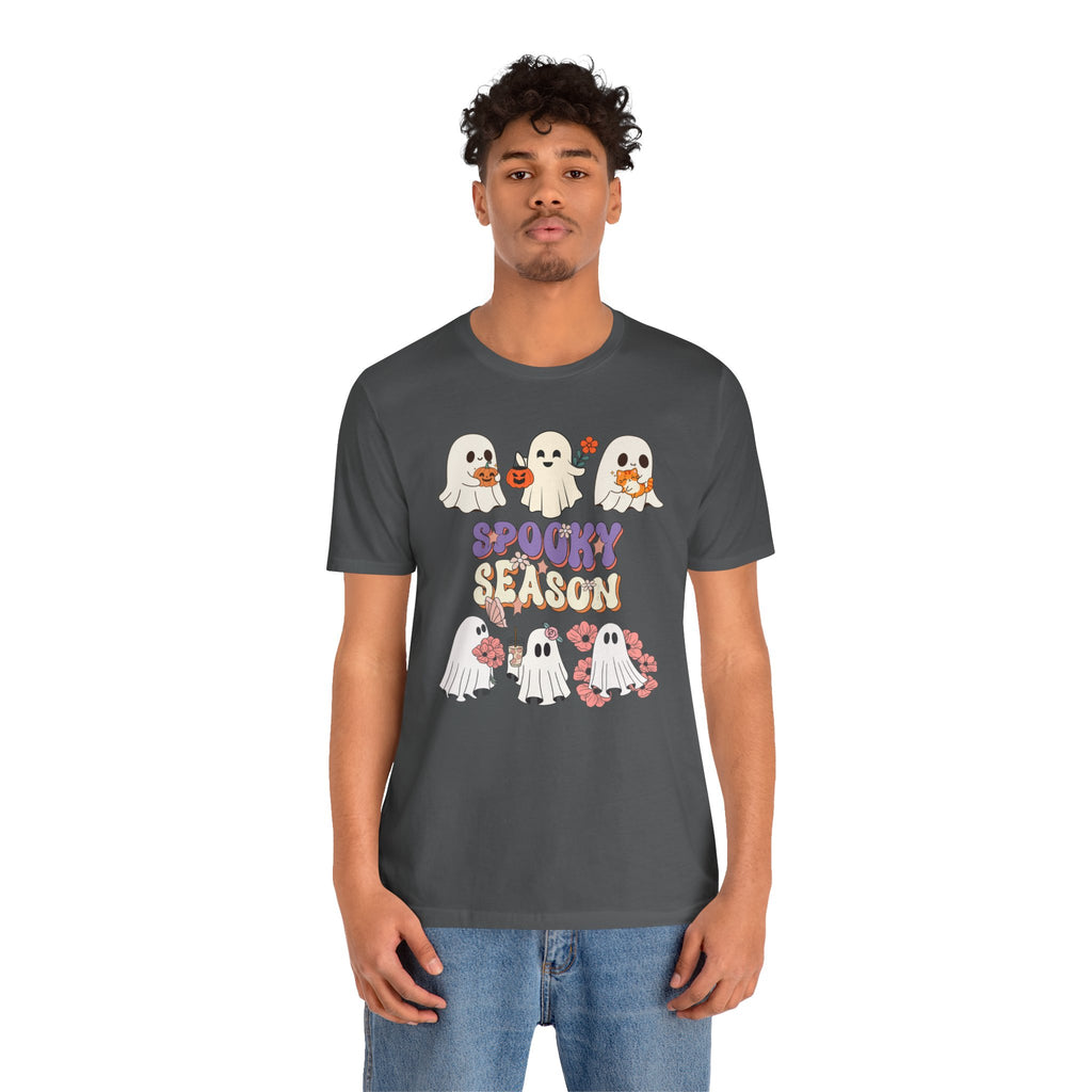 Person wearing a dark gray t-shirt with Halloween-themed design on a white background