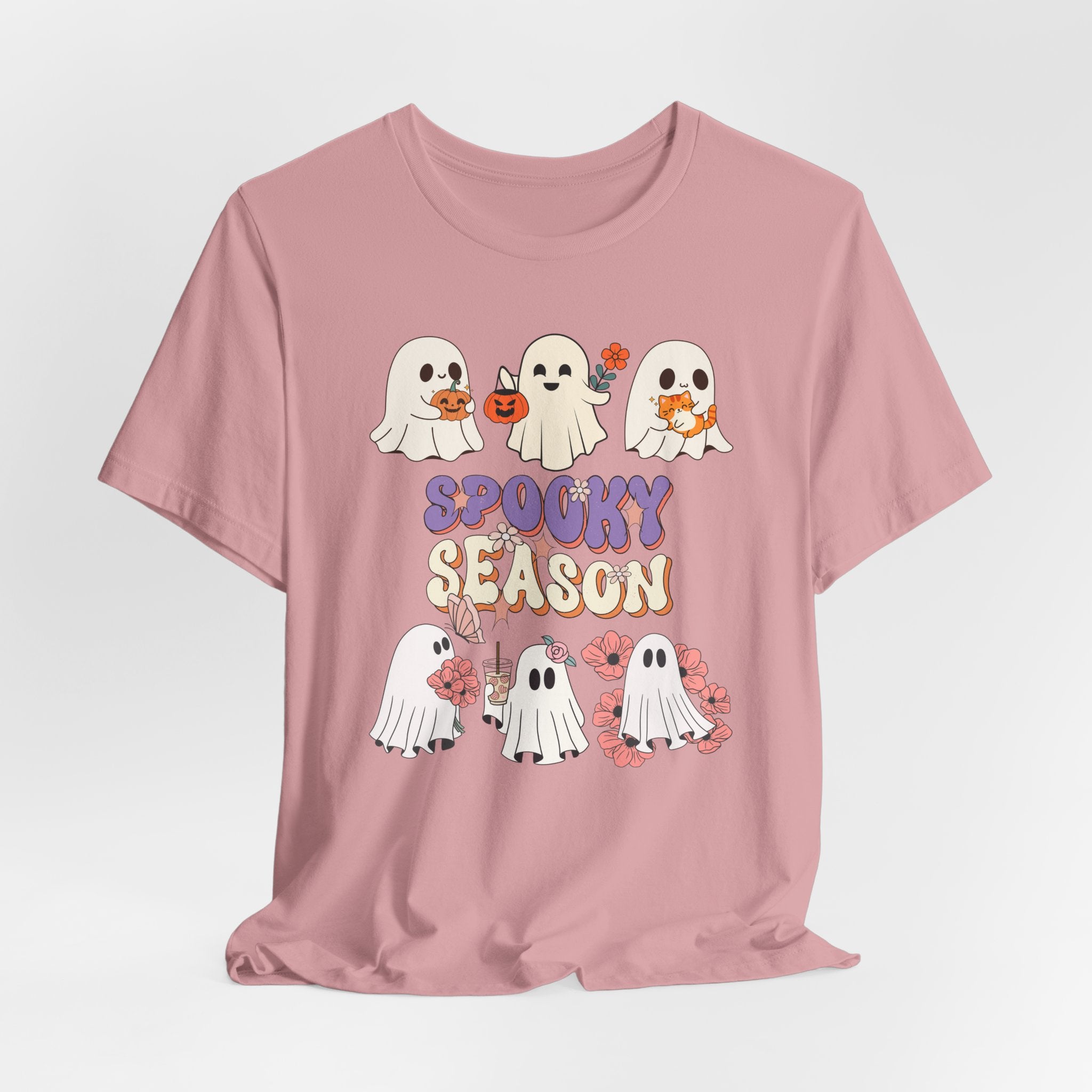Orchid pink t-shirt with cartoon ghosts and 'Spooky Season' text on a light gray background