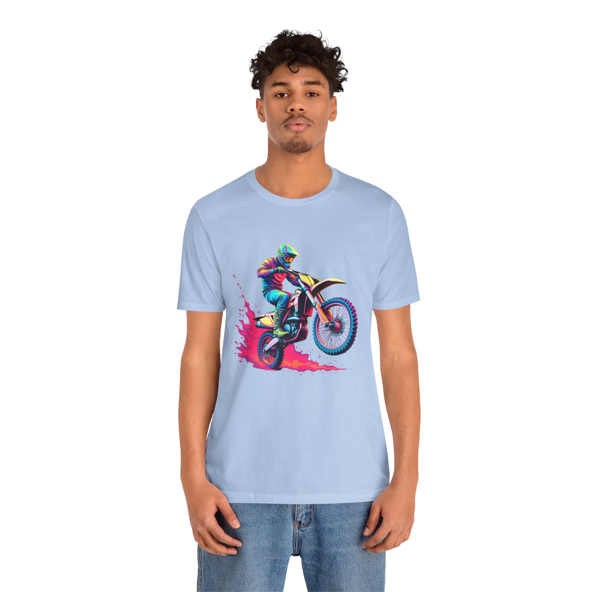 Person wearing a baby blue t-shirt with a colorful graphic design on a white background