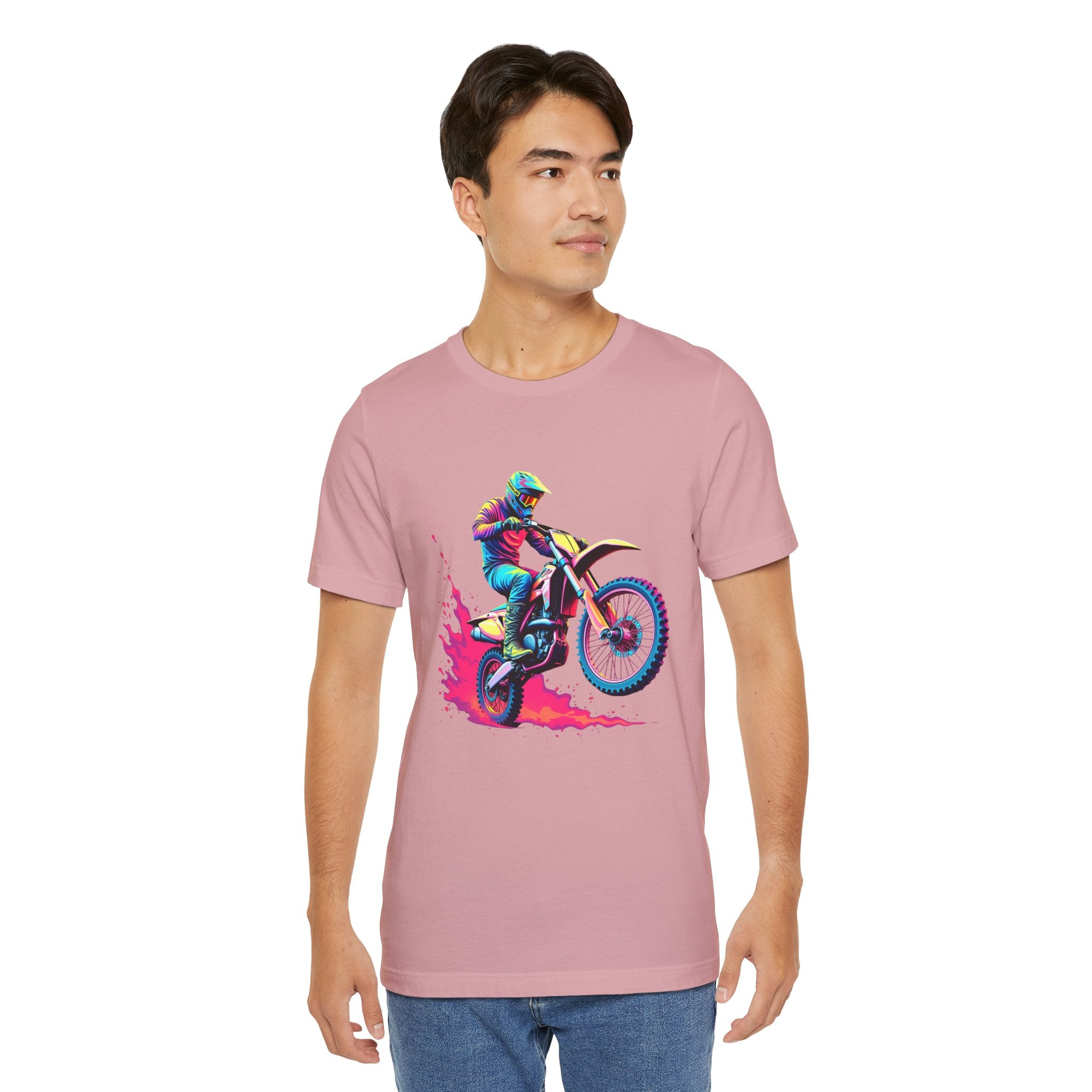 Person wearing a orchid pink t-shirt with a colorful graphic of a person on a motorcycle.