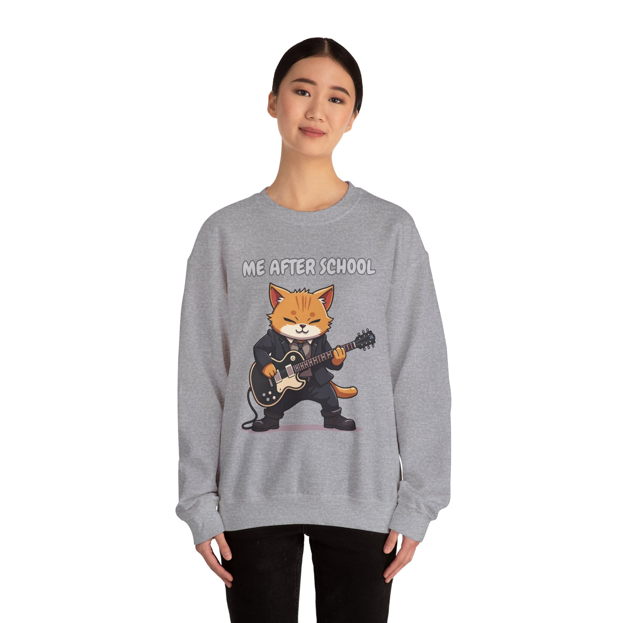 A woman wearing sport grey sweatshirt with a cartoon cat playing guitar and 'Me After School' text on a white background