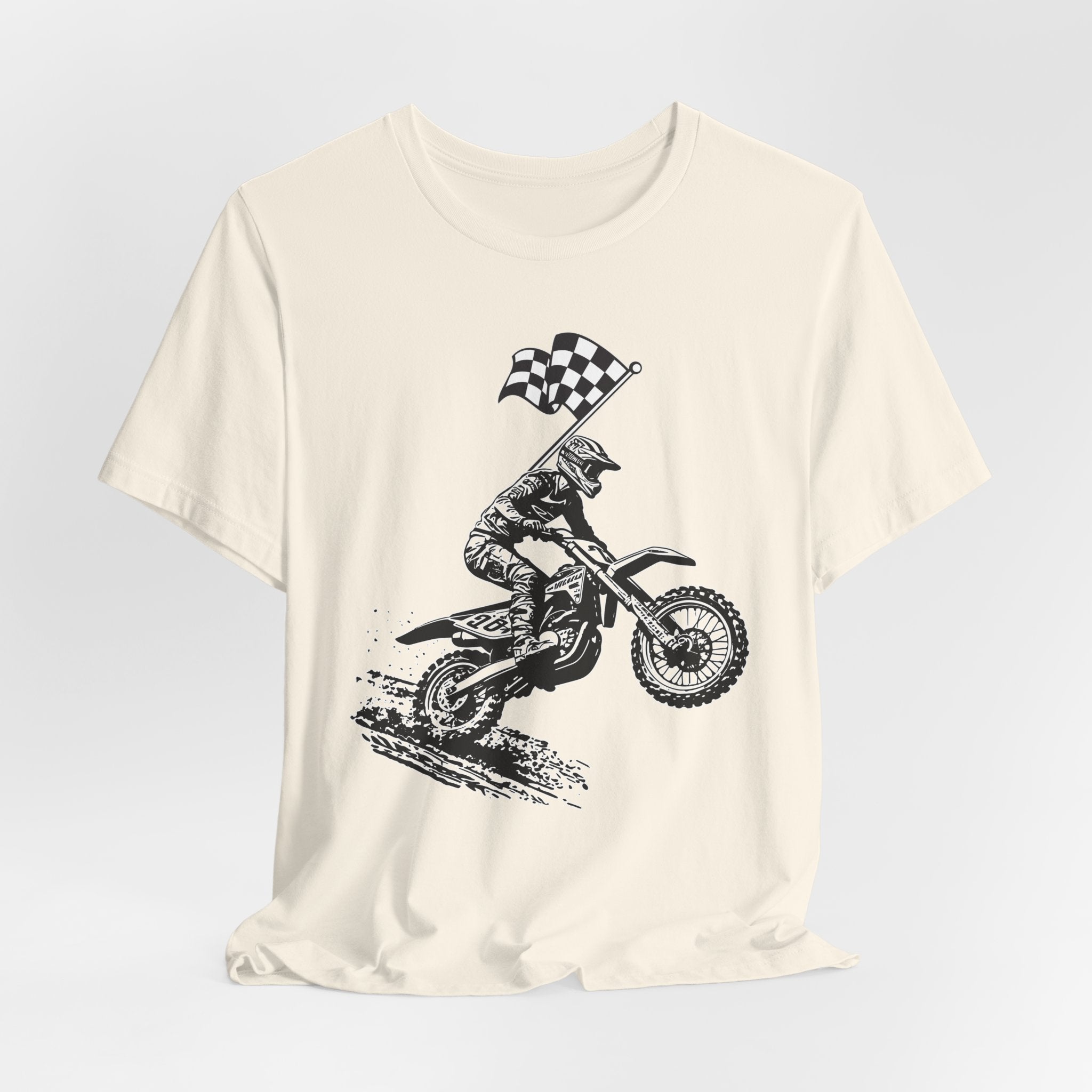 Ivory beige t-shirt with a graphic of a extreme dirt motocross rider and checkered flag on a white background