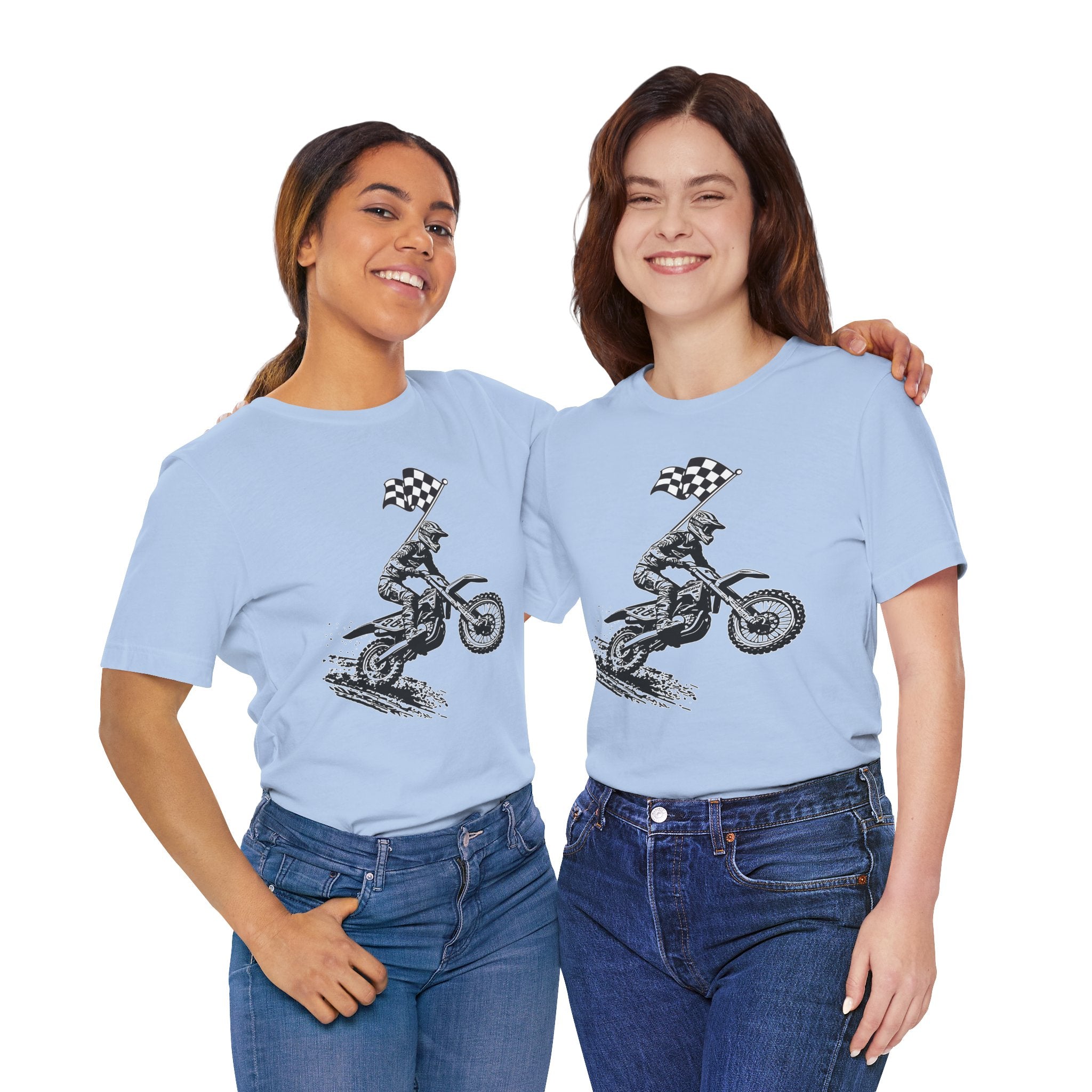 Two women wearing light blue t-shirts with a graphic design of a person on a motorcycle with a checkered flag.
