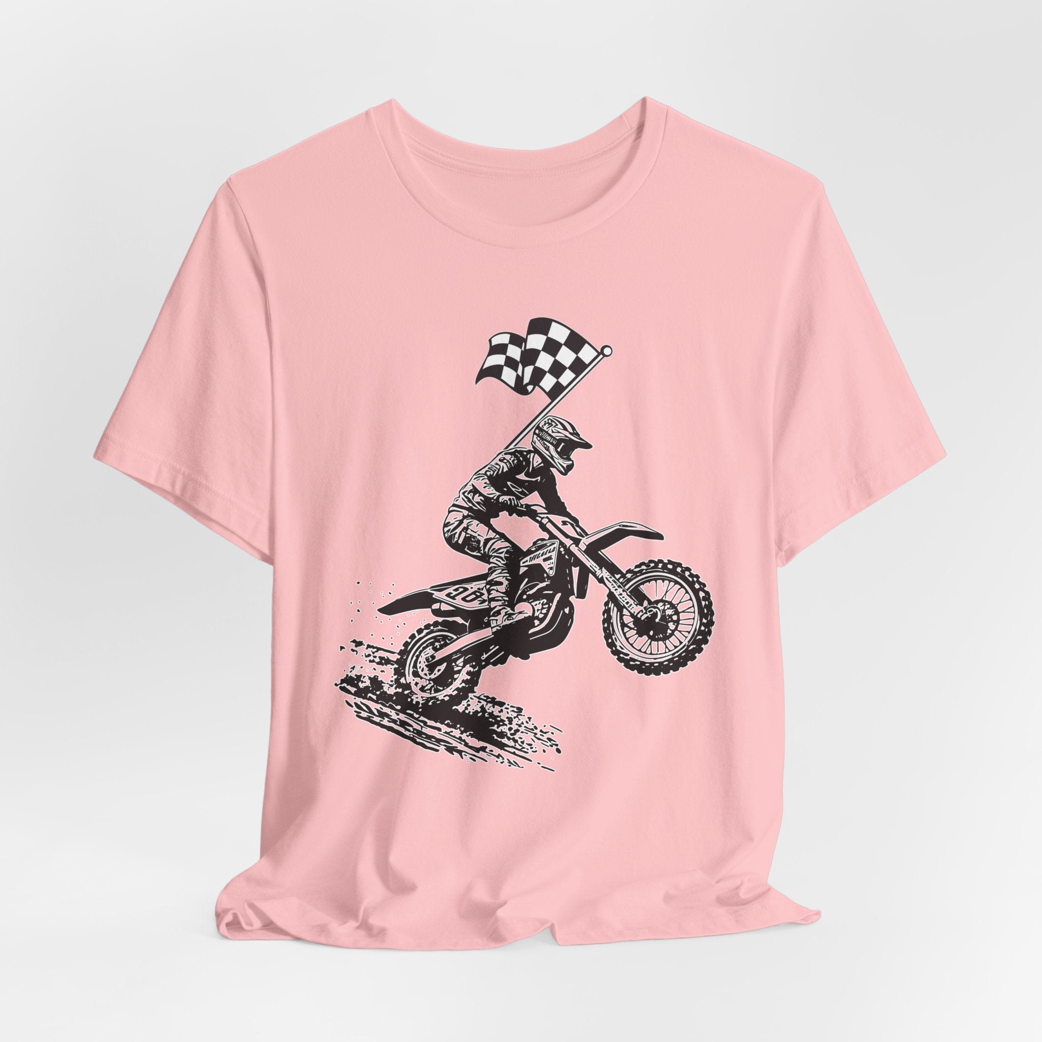 Pink t-shirt with a graphic of a extreme dirt motocross rider and checkered flag on a white background