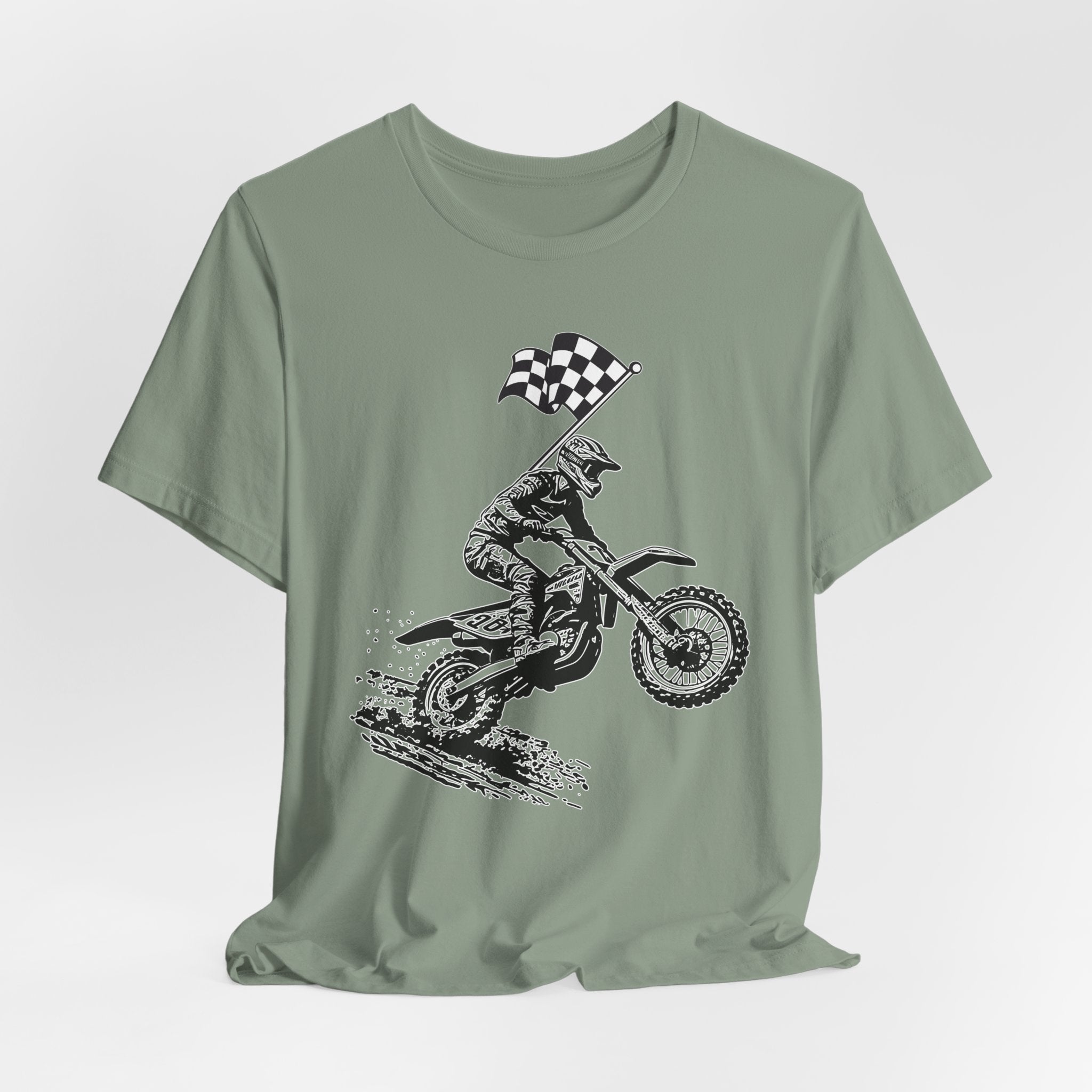 Sage green t-shirt with a graphic of a extreme dirt motocross rider and checkered flag on a white background