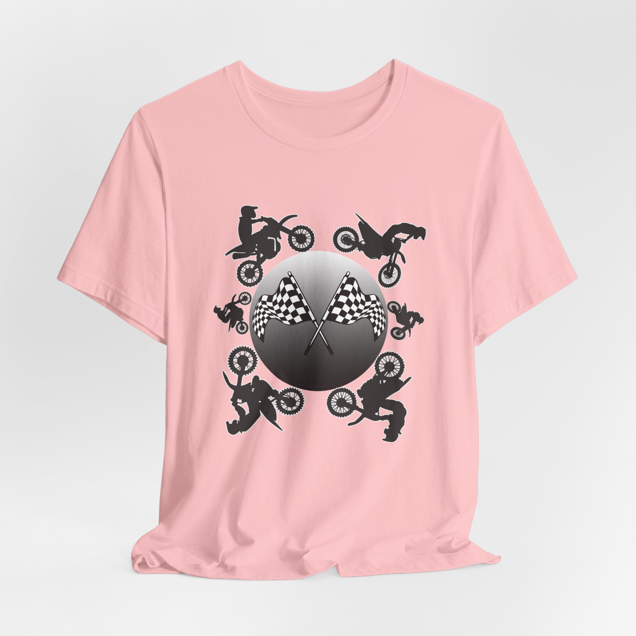 Pink t-shirt with motocross dirt bike graphics and checkered flags on a light gray background