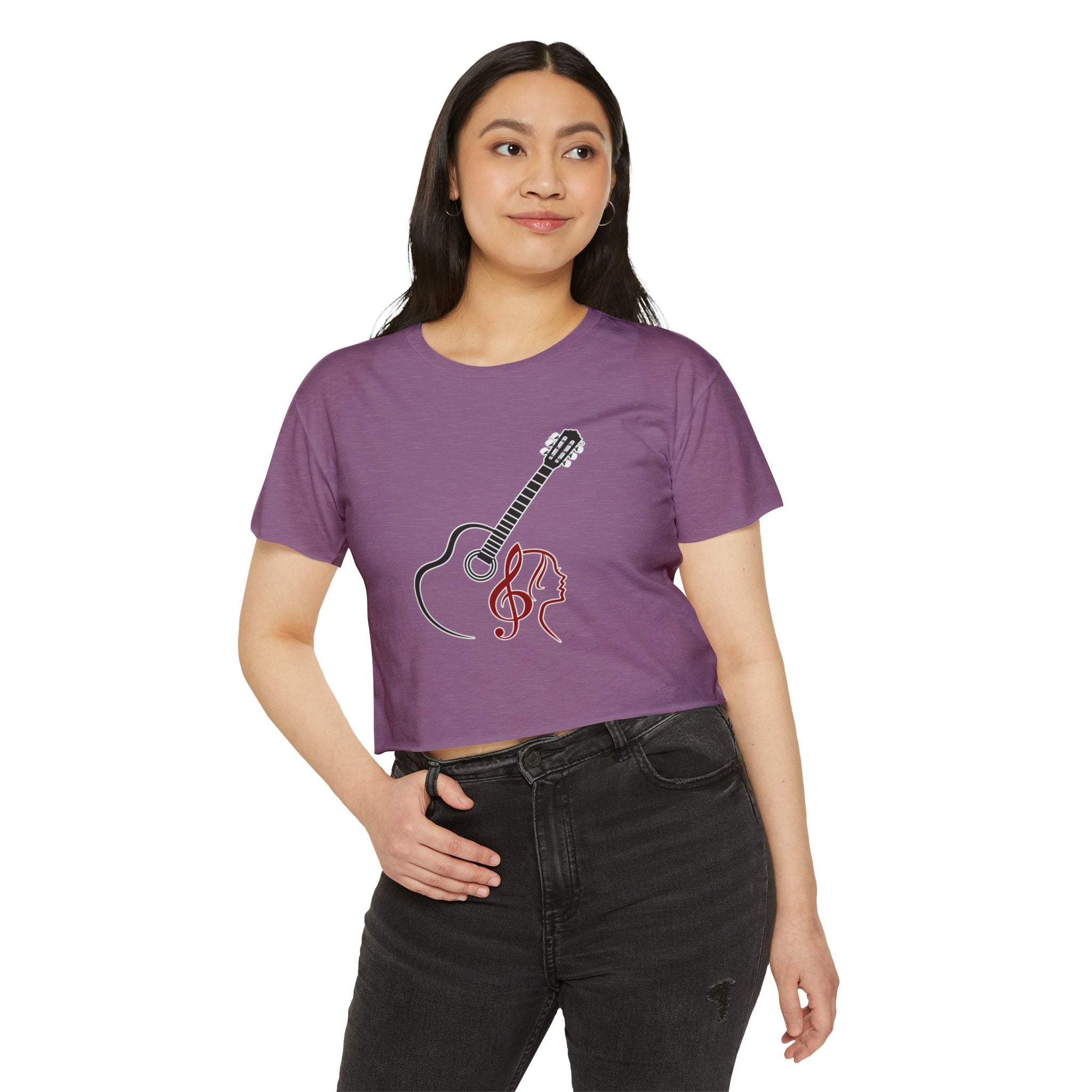 Person wearing a purple t-shirt with a guitar design on a white background