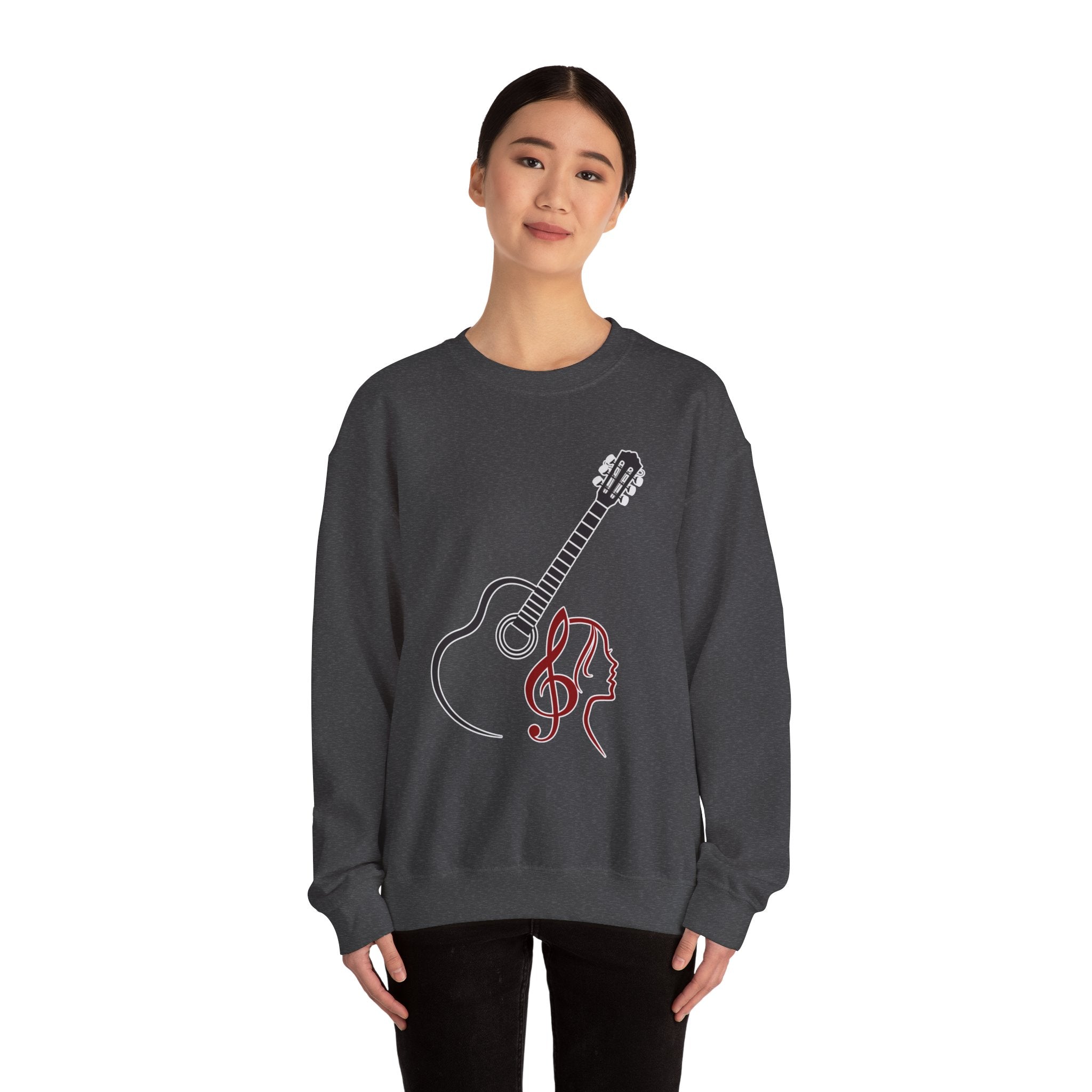 Person wearing a dark gray sweatshirt with a guitar and treble clef design on a white background