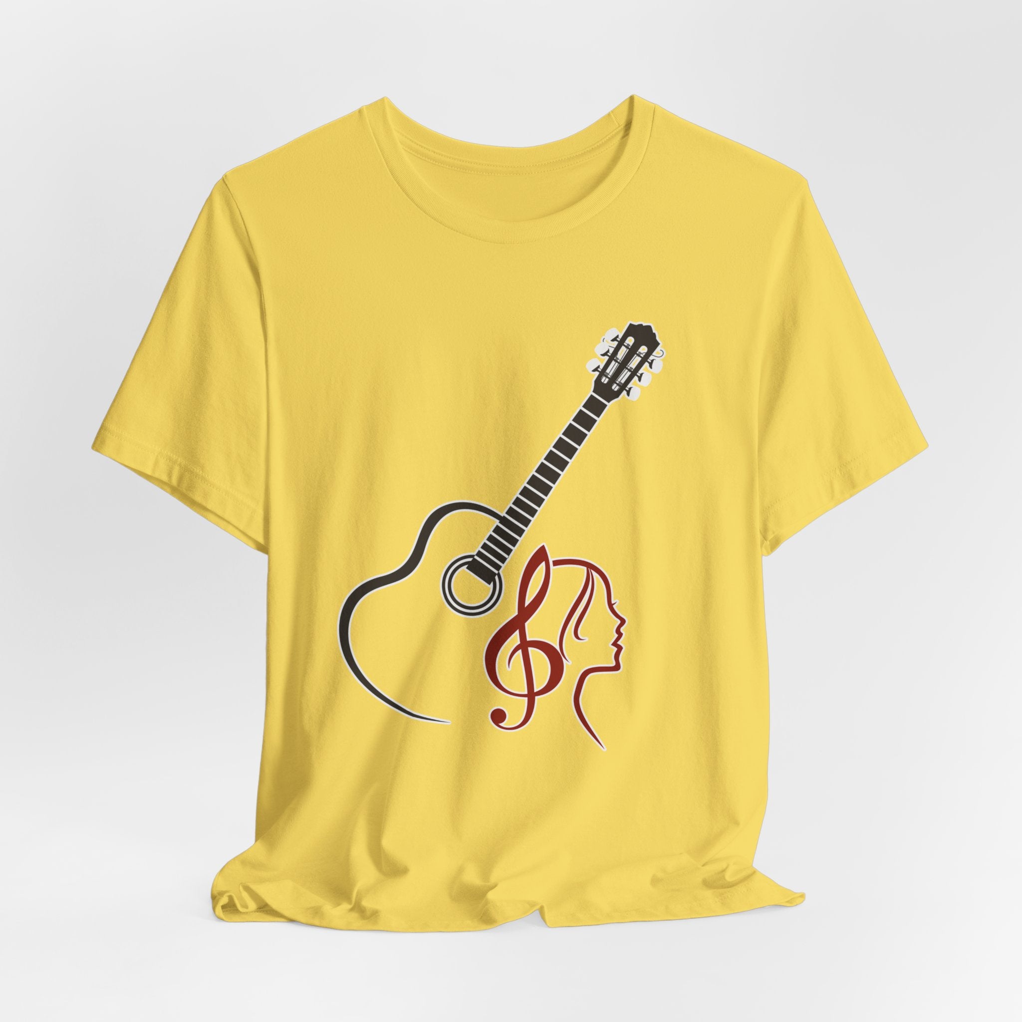 Yellow t-shirt with a guitar and treble clef design on a white background