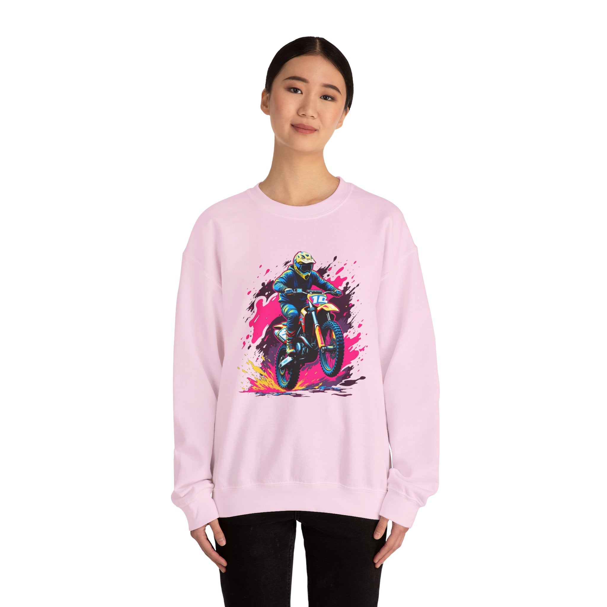 Person wearing a pink sweatshirt with a graphic design on a white background