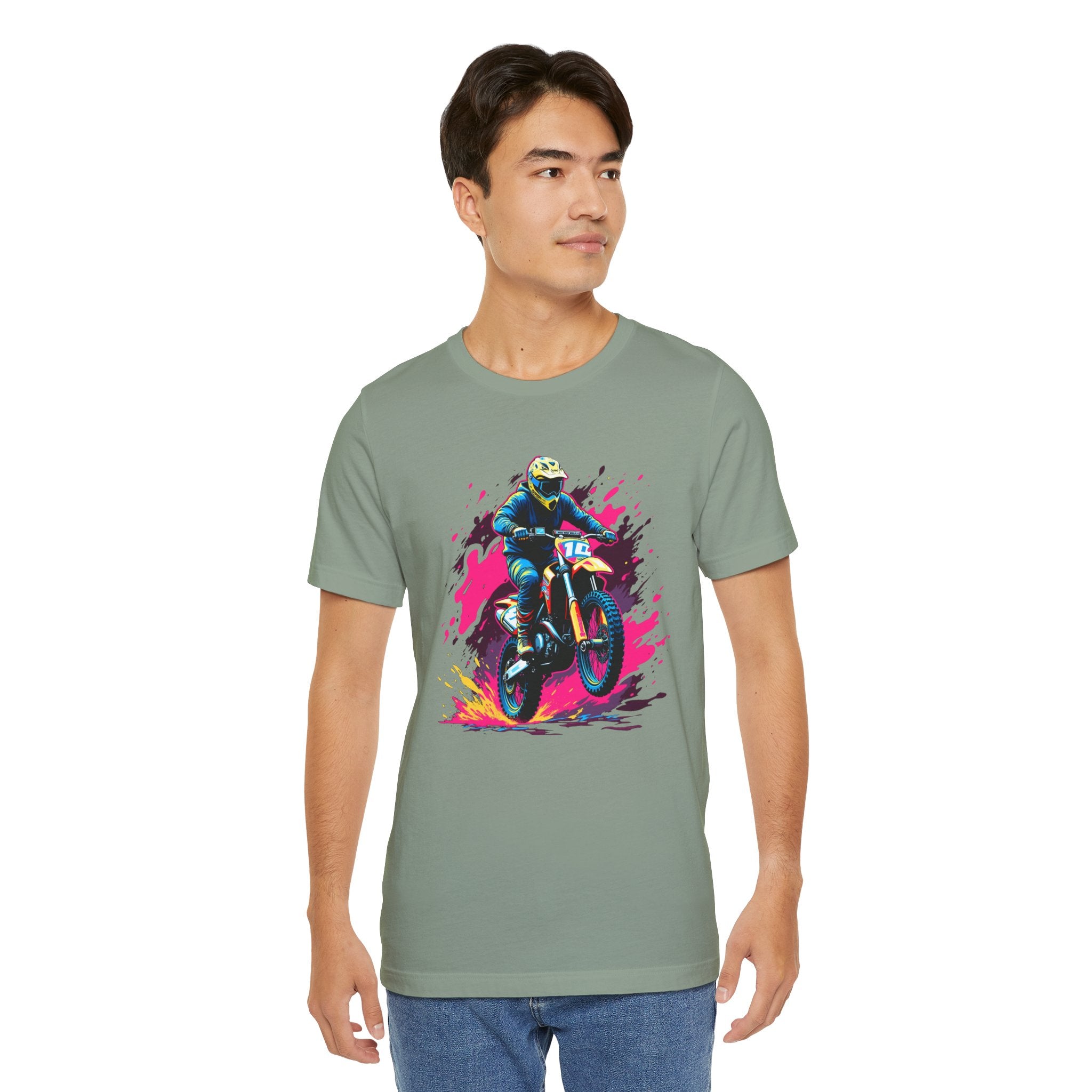 Man wearing a green t-shirt with a colorful graphic of a motorcycle rider on a white background