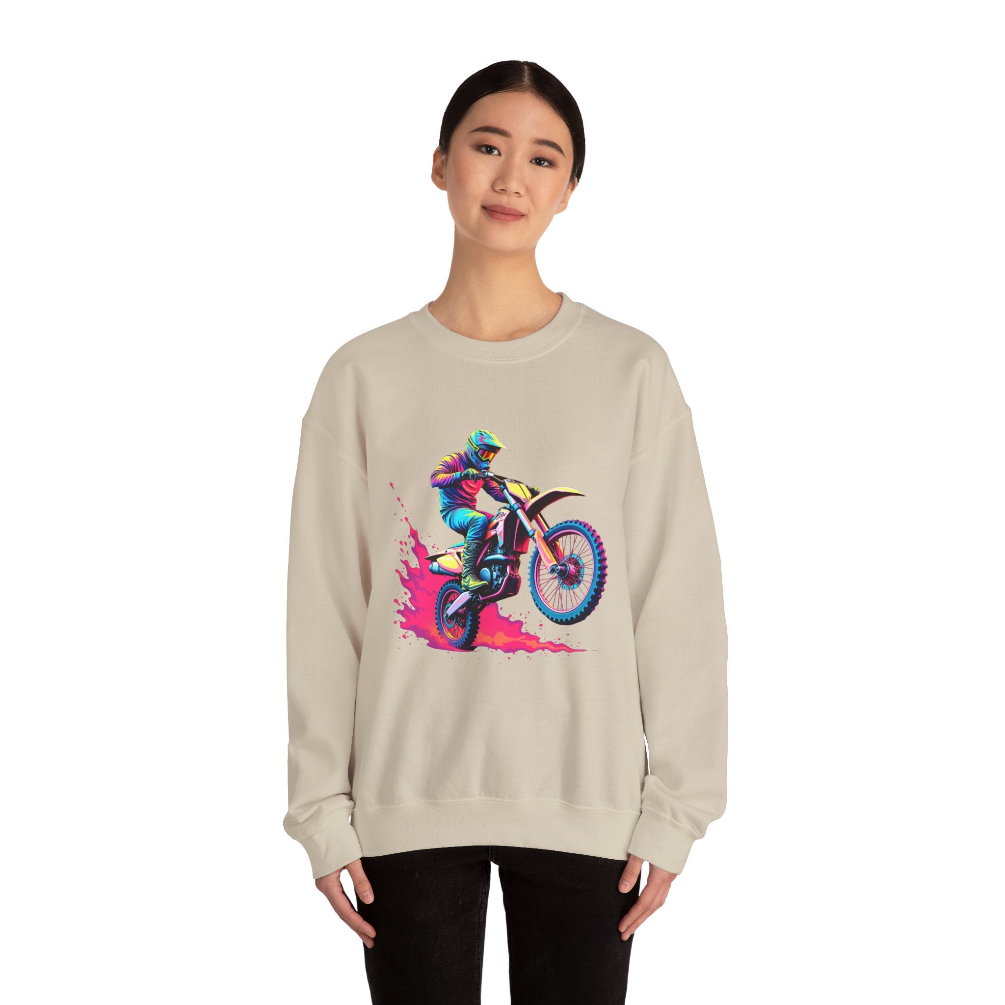 Person wearing a beige sweatshirt with a colorful graphic of a person on a motorcycle.