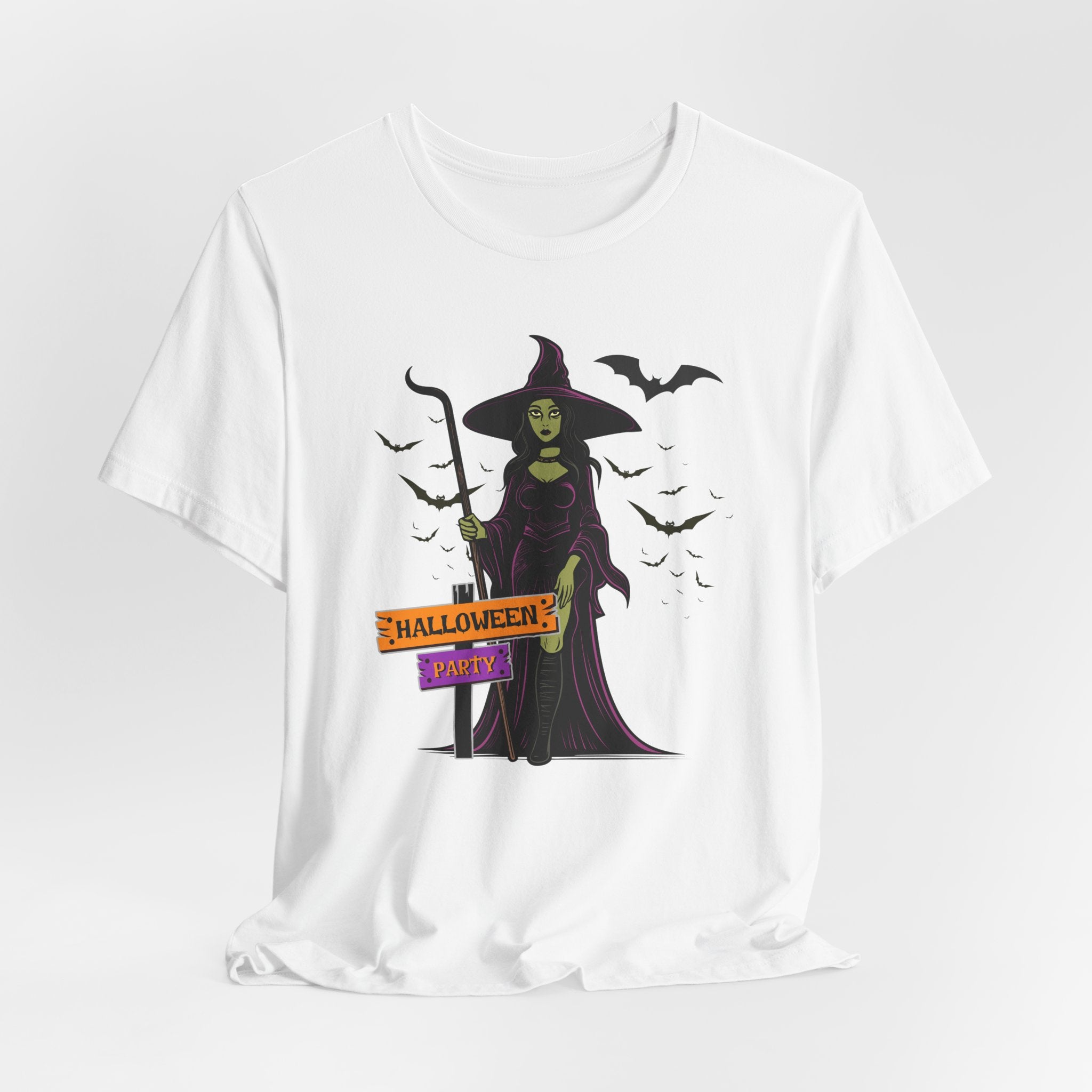 White t-shirt with a Halloween-themed design featuring a witch and bats on a white background